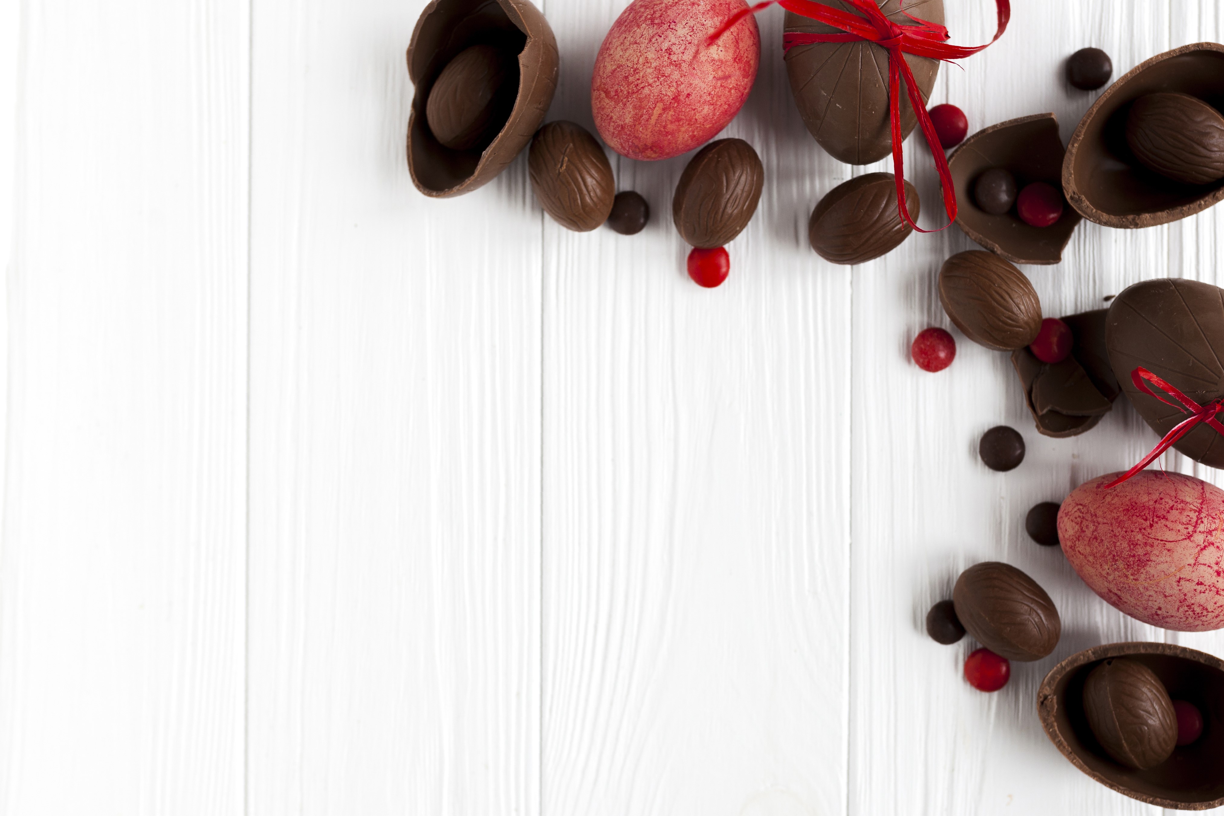Easter Chocolate Eggs and Sweets on Wood Planks HD Wallpaper