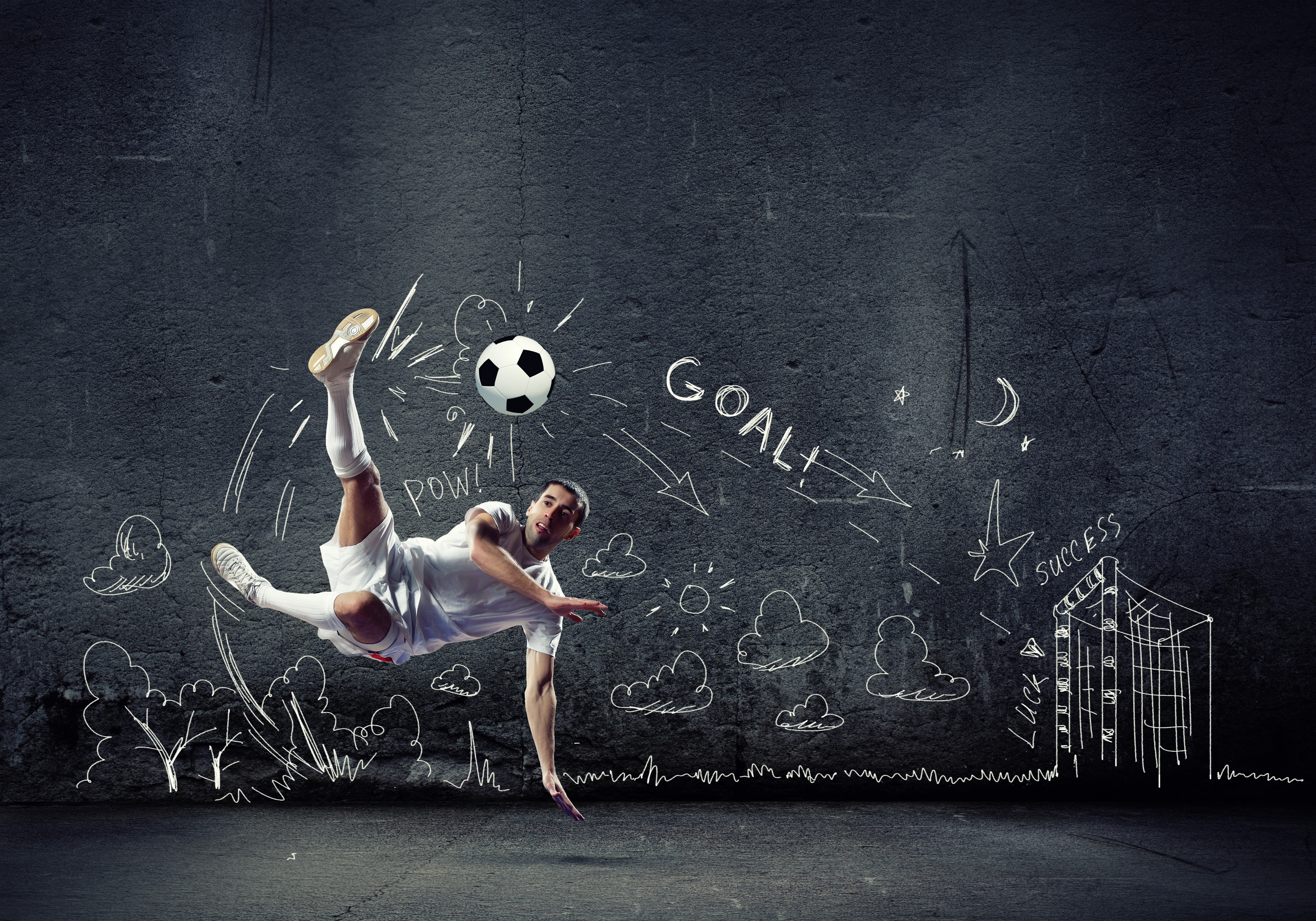 Man performing a bicycle kick with a soccer ball HD Wallpaper