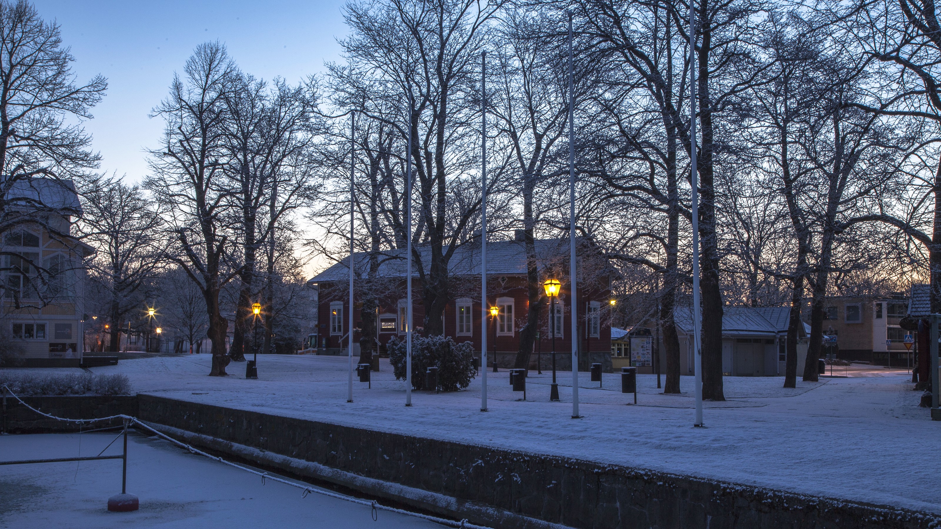 Winter evening in Naantali, Finland with snow and street lights HD Wallpaper