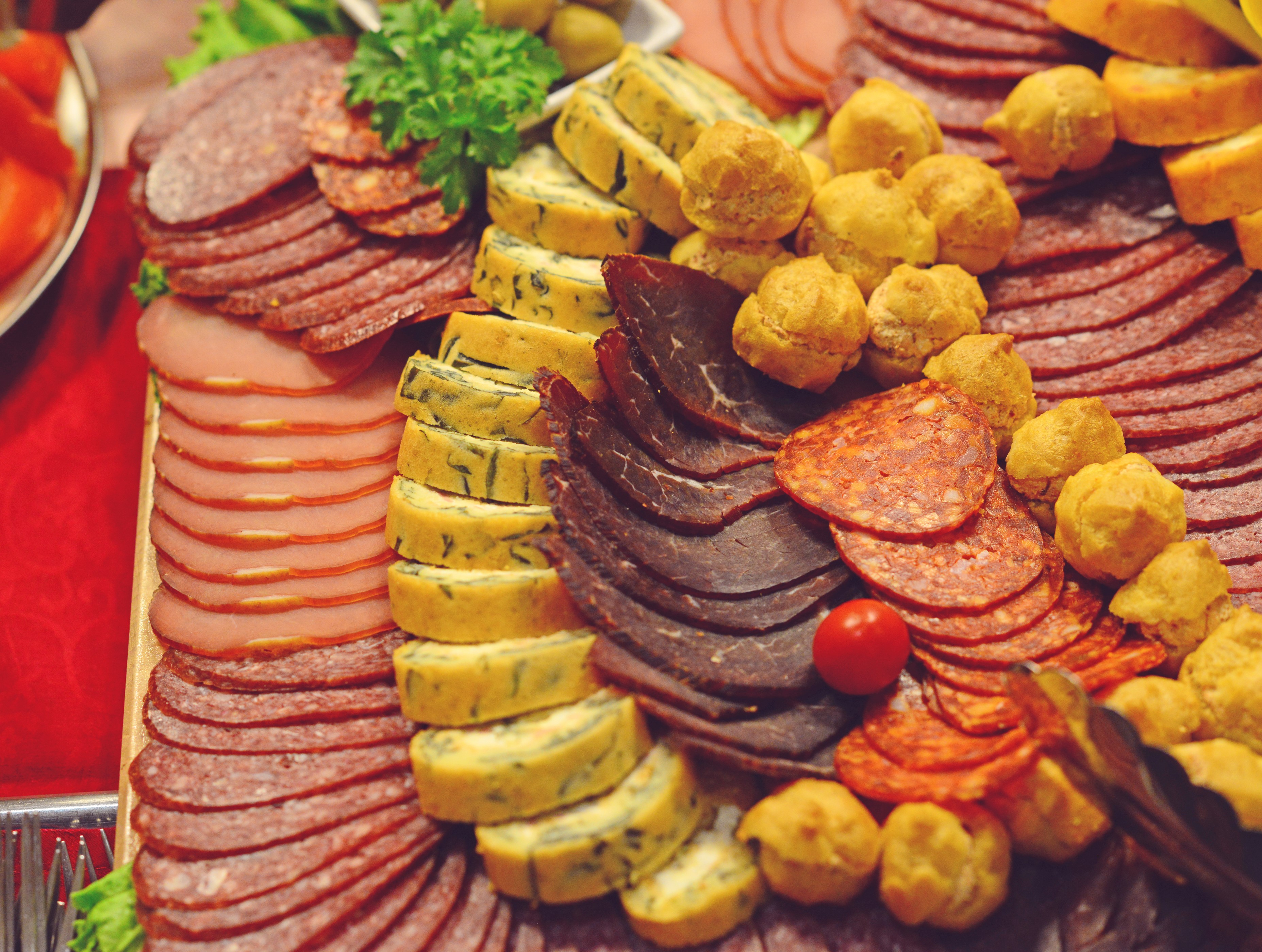 Assortment of sliced meats, cheese rolls, and bread rolls HD Wallpaper