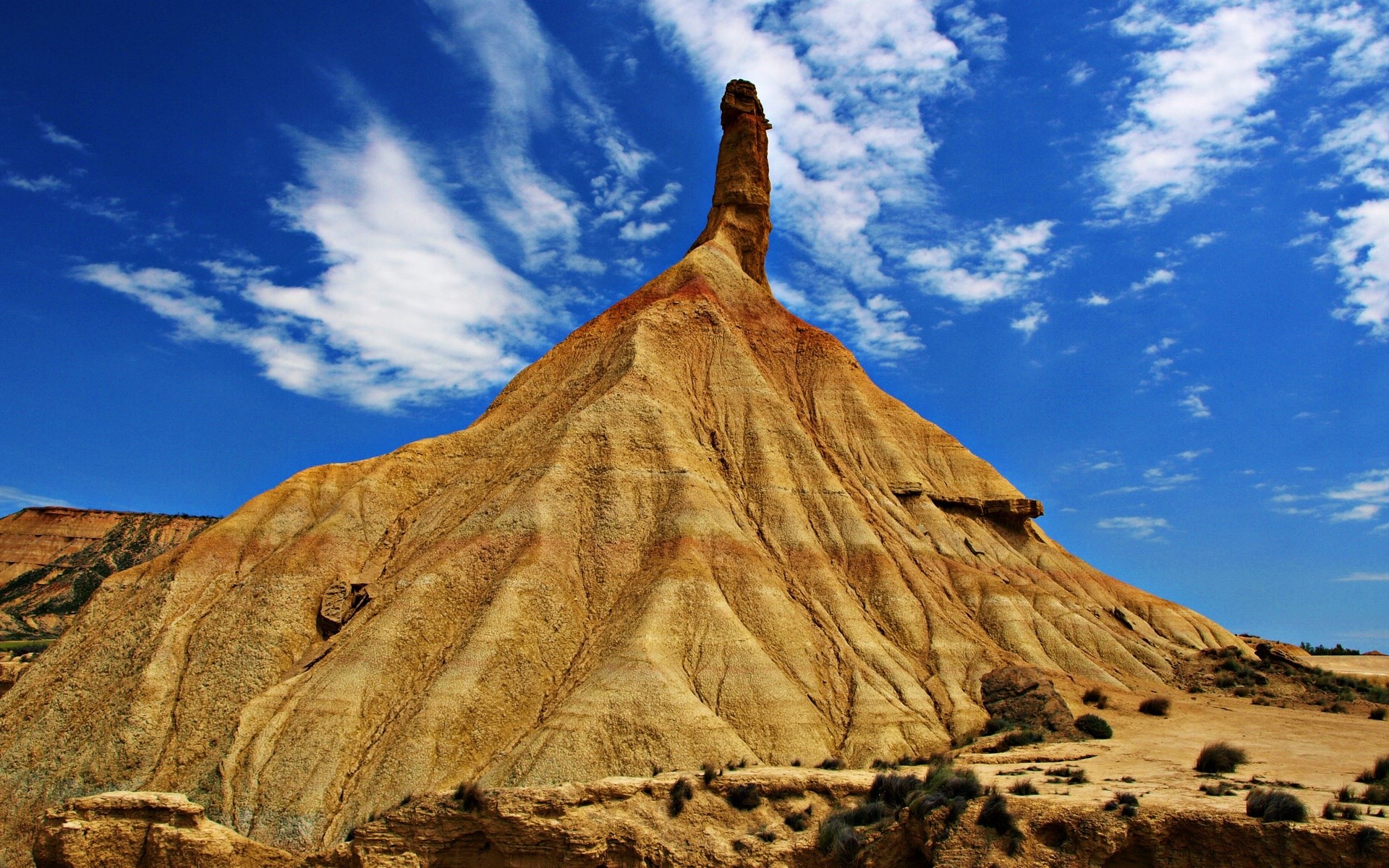 Desert landscape with rock formations and blue sky HD Wallpaper