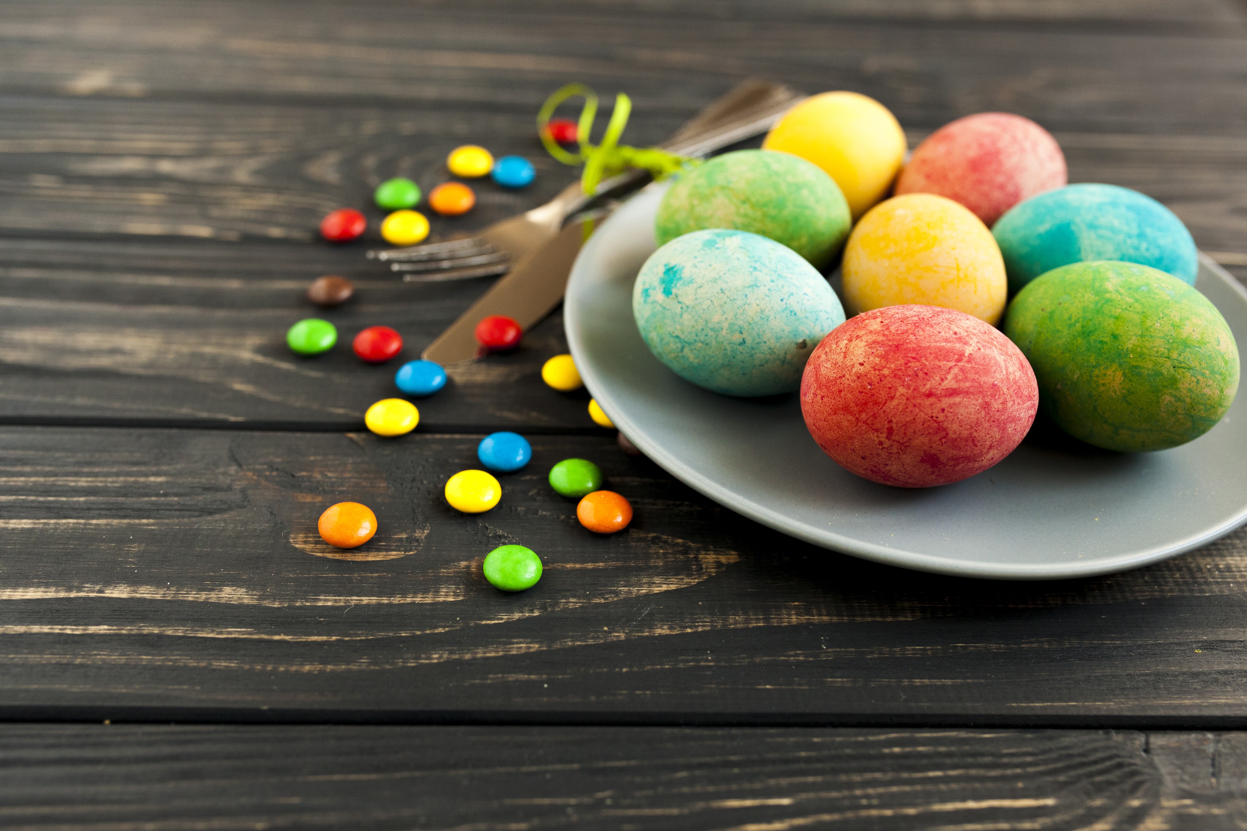 Easter Eggs and Candy on Wooden Table HD Wallpaper