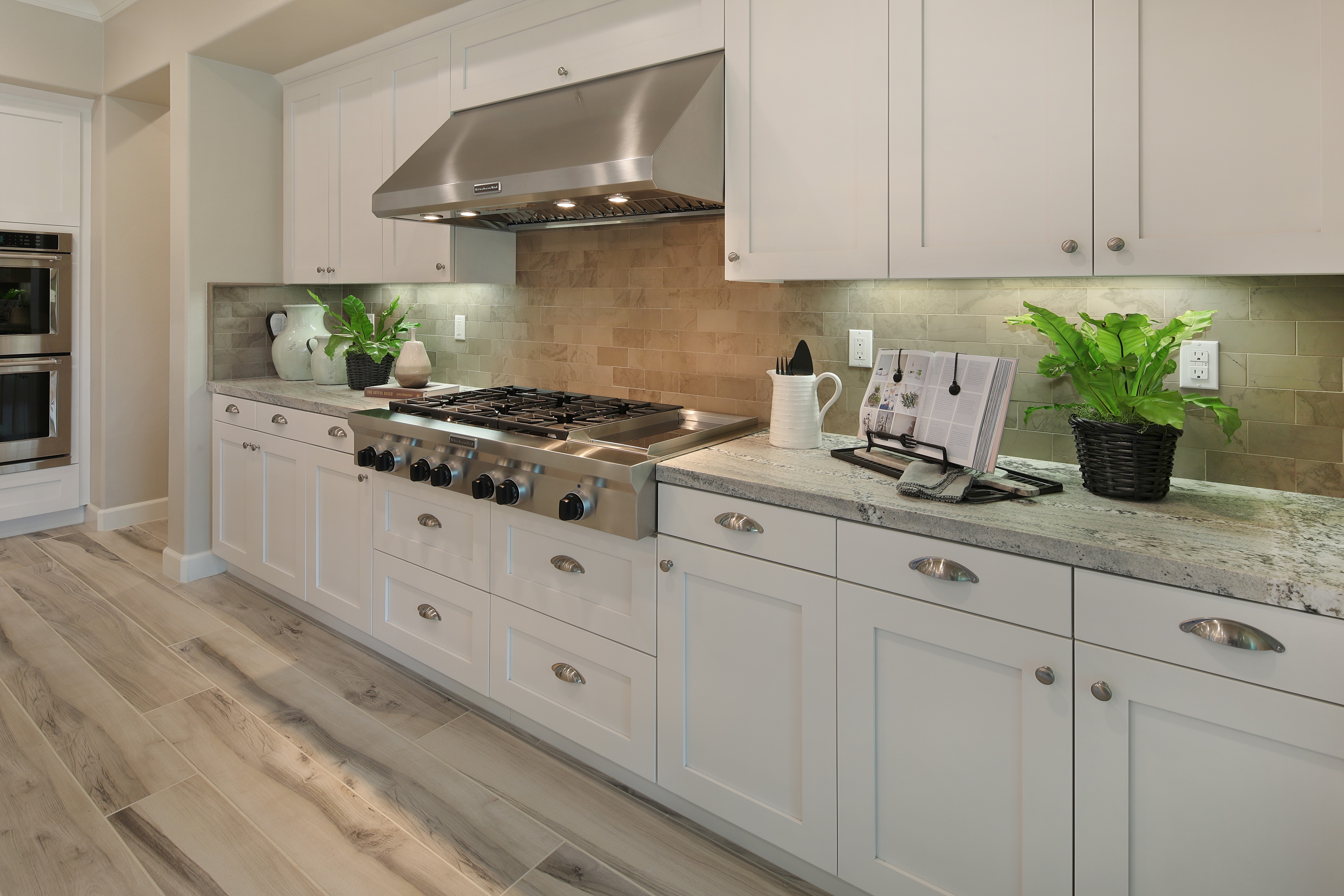 Modern Kitchen with Stainless Steel Appliances and White Cabinets HD Wallpaper