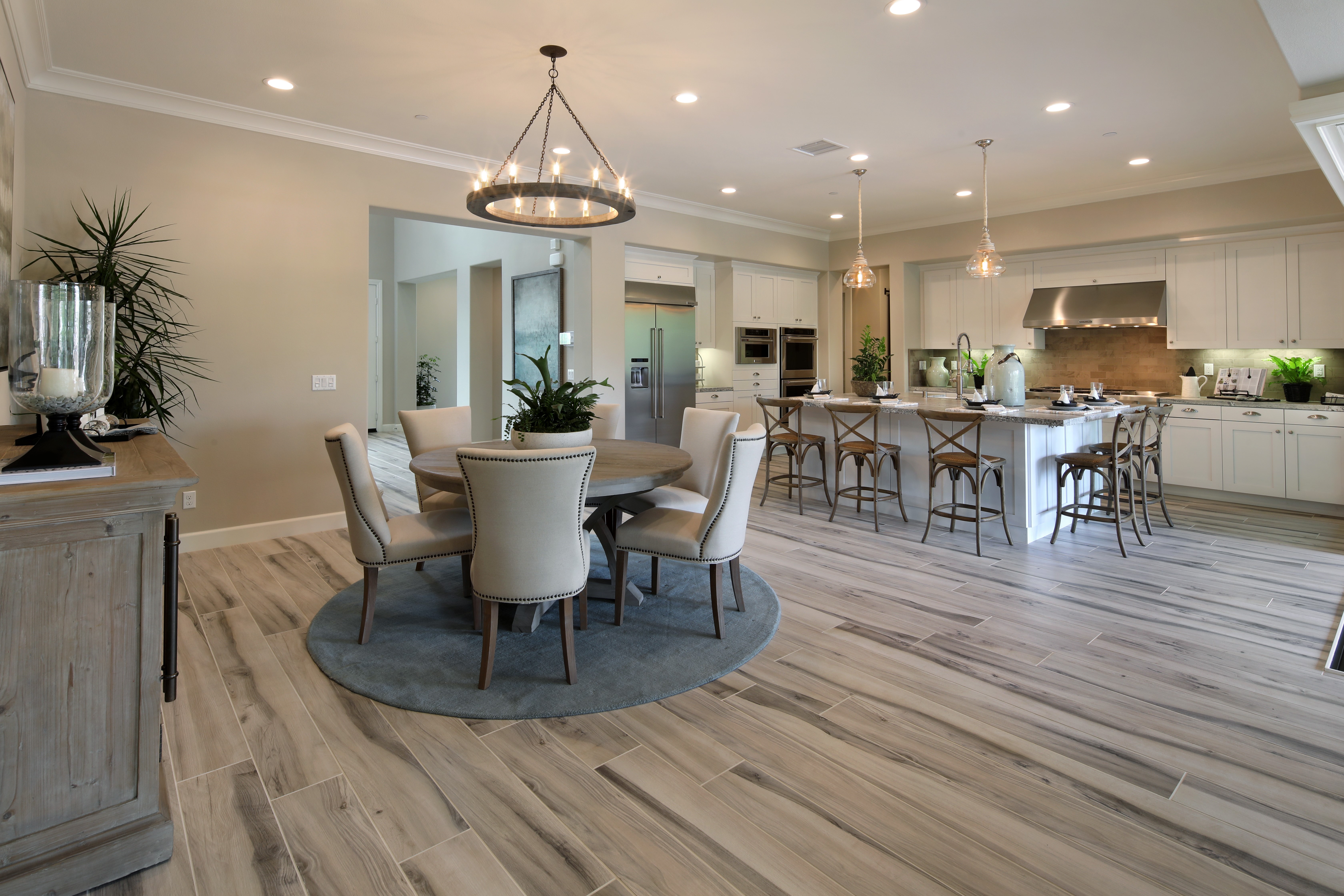 Interior design of a dining room and kitchen with a chandelier HD Wallpaper