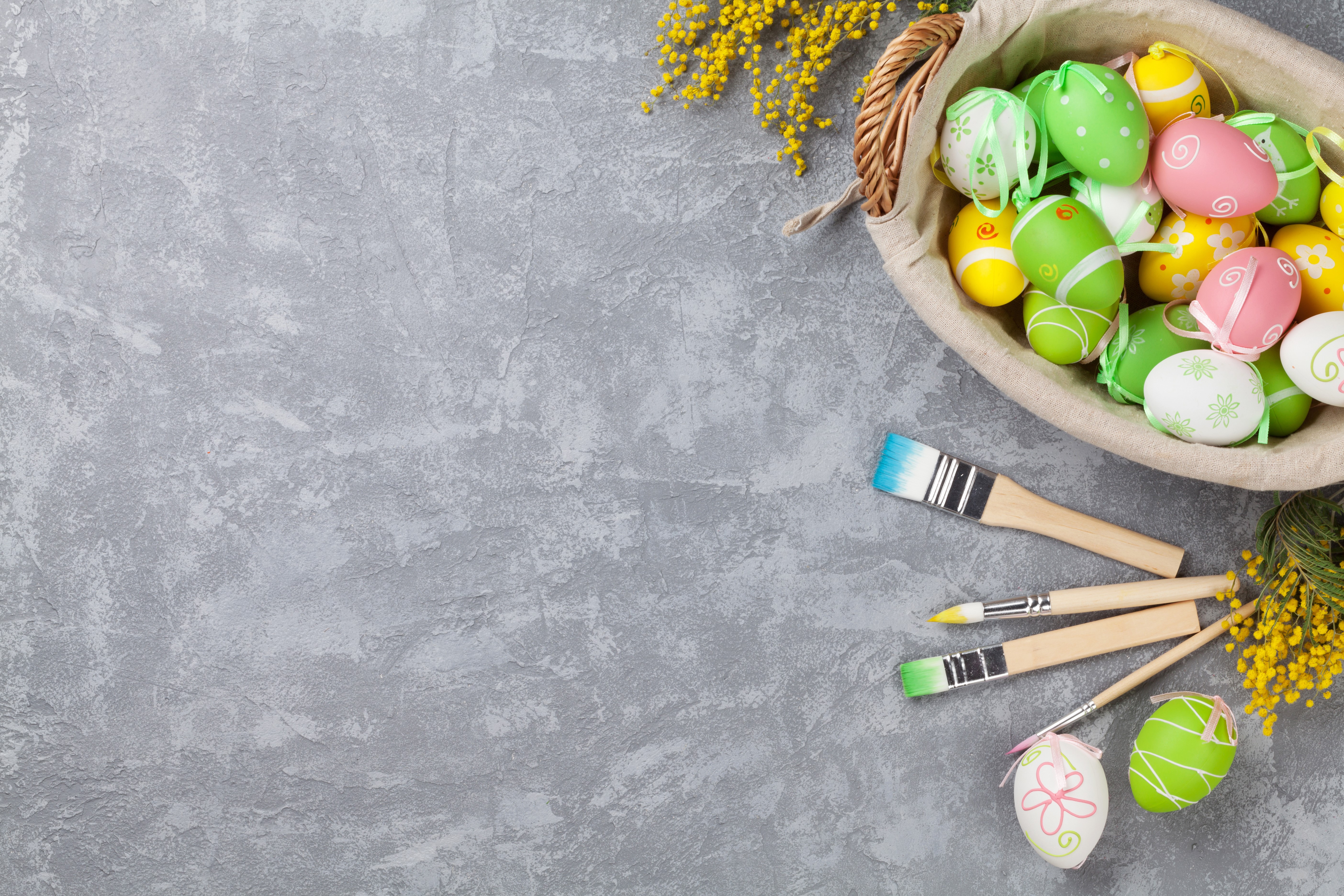 Easter Eggs and Paintbrushes on a Gray Surface HD Wallpaper