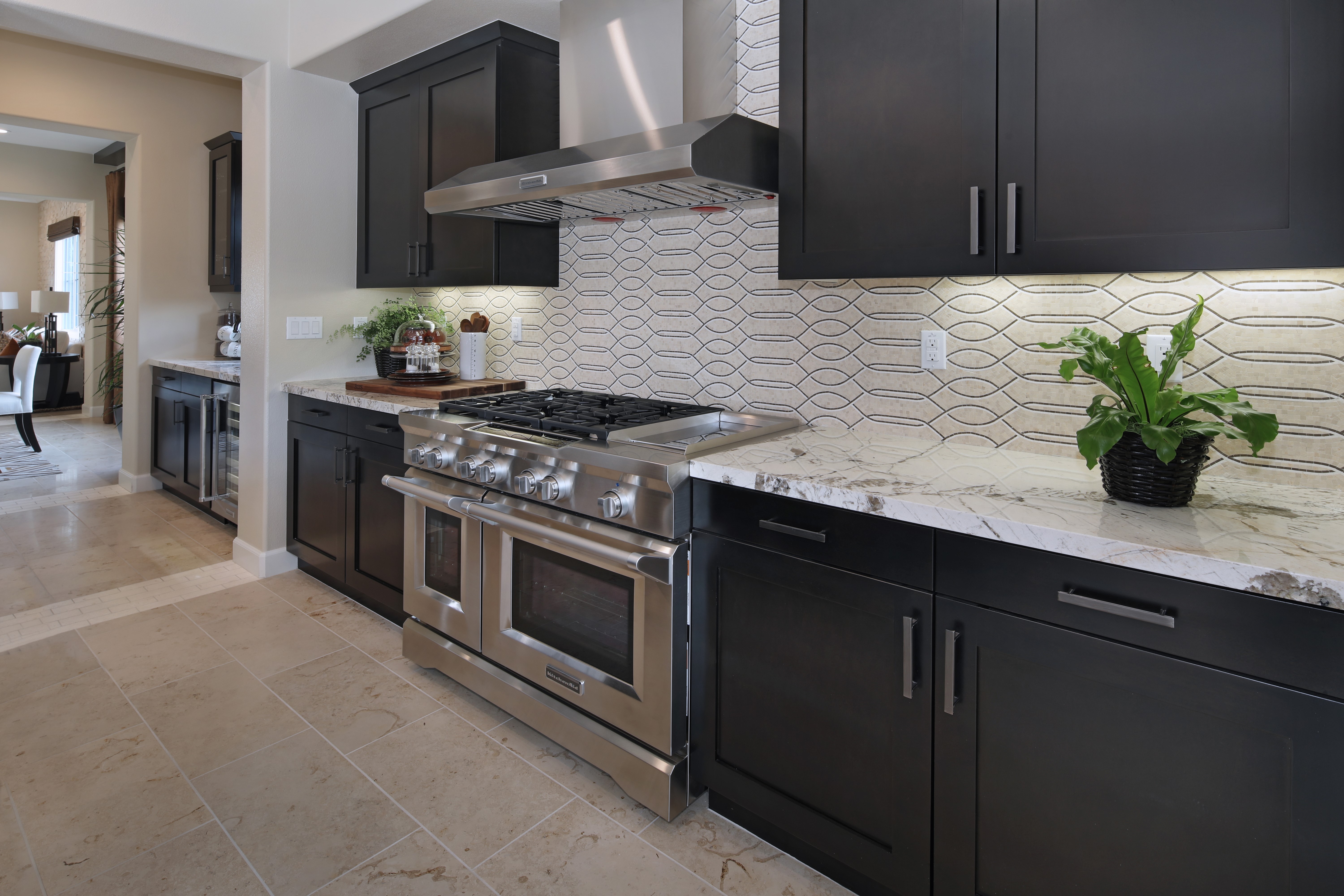 Modern Kitchen with Dark Cabinets and Stainless Steel Appliances HD Wallpaper