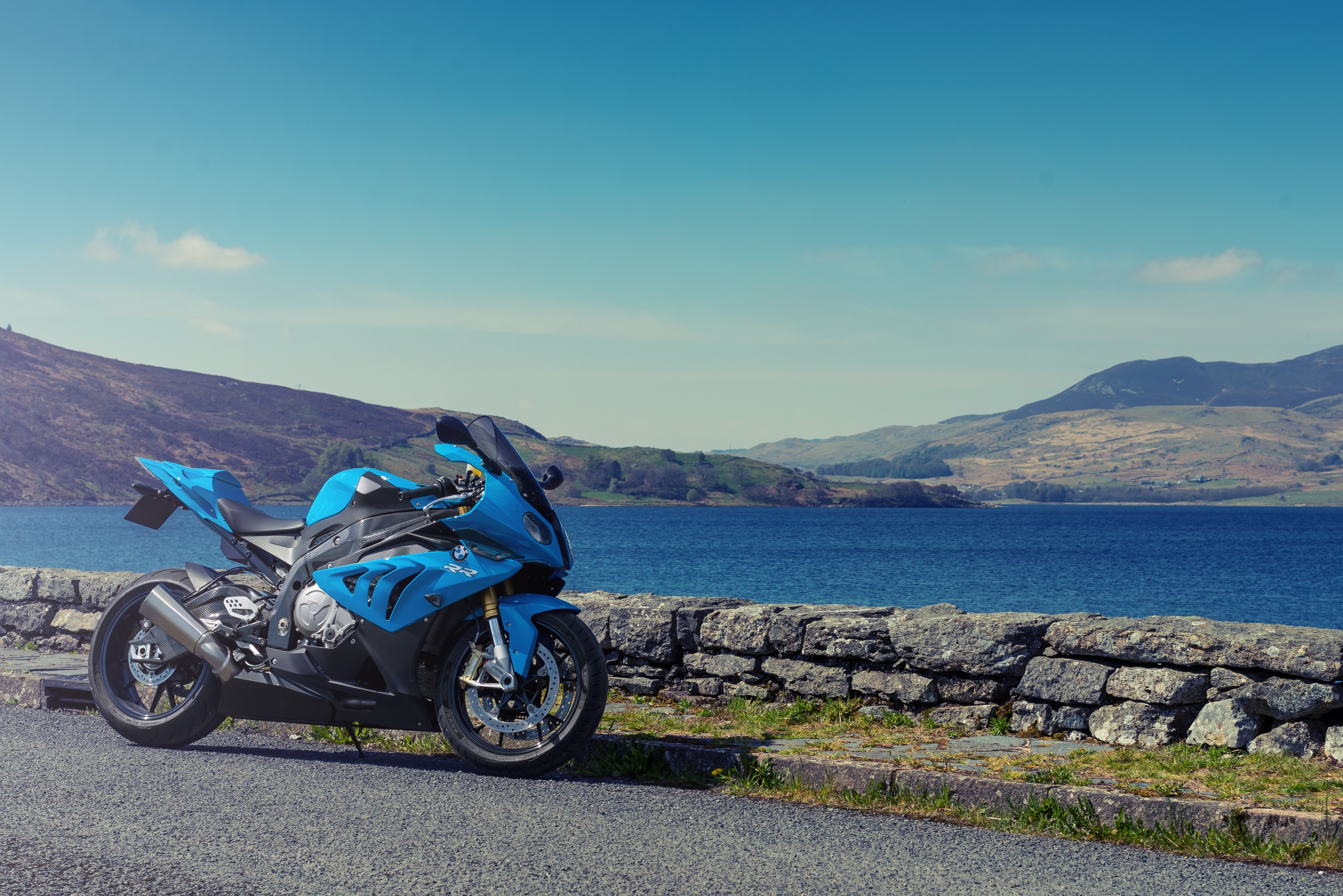 Blue BMW S1000 RR motorcycle by a lake HD Wallpaper