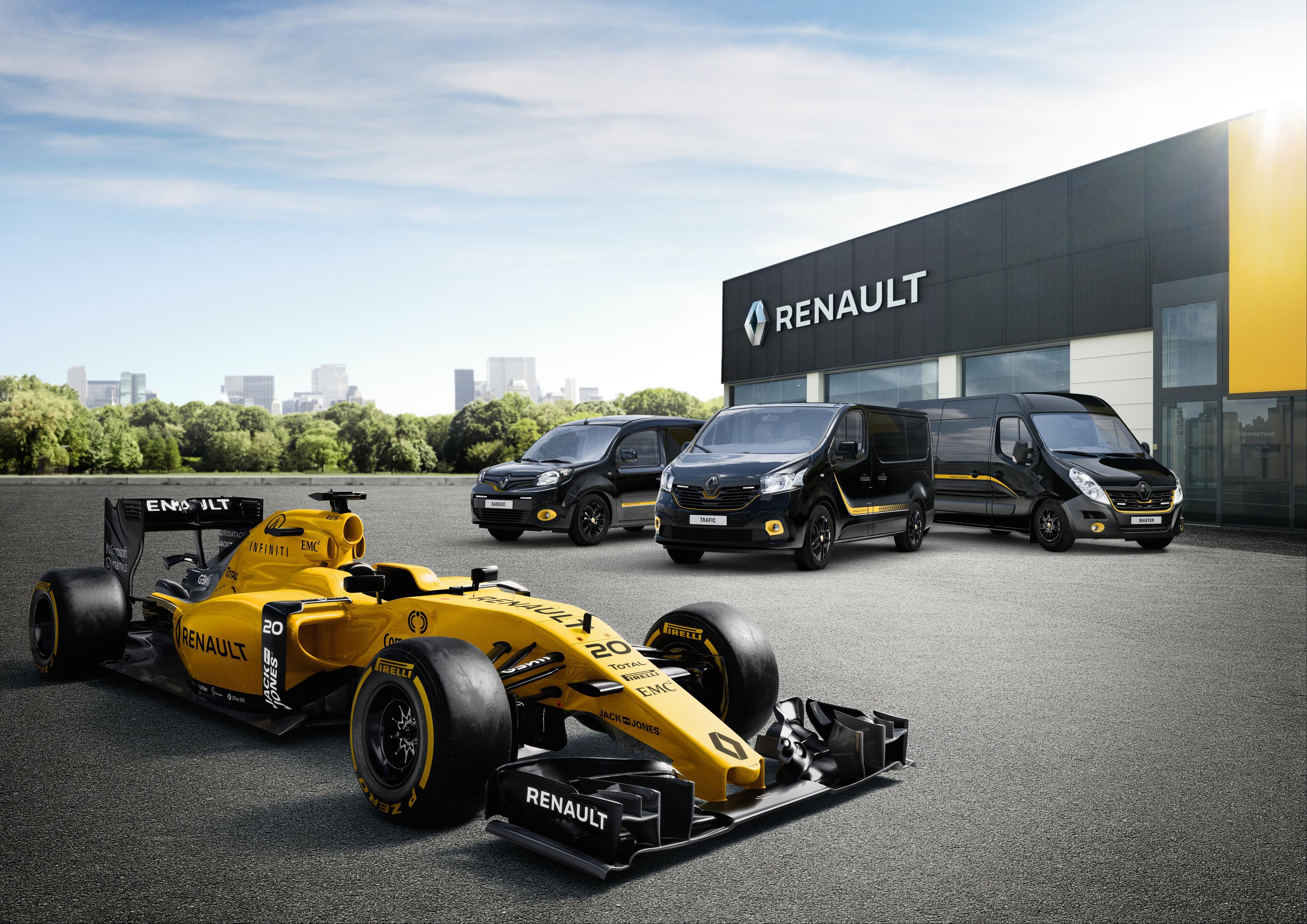 Renault Formula 1 car and vans at dealership HD Wallpaper