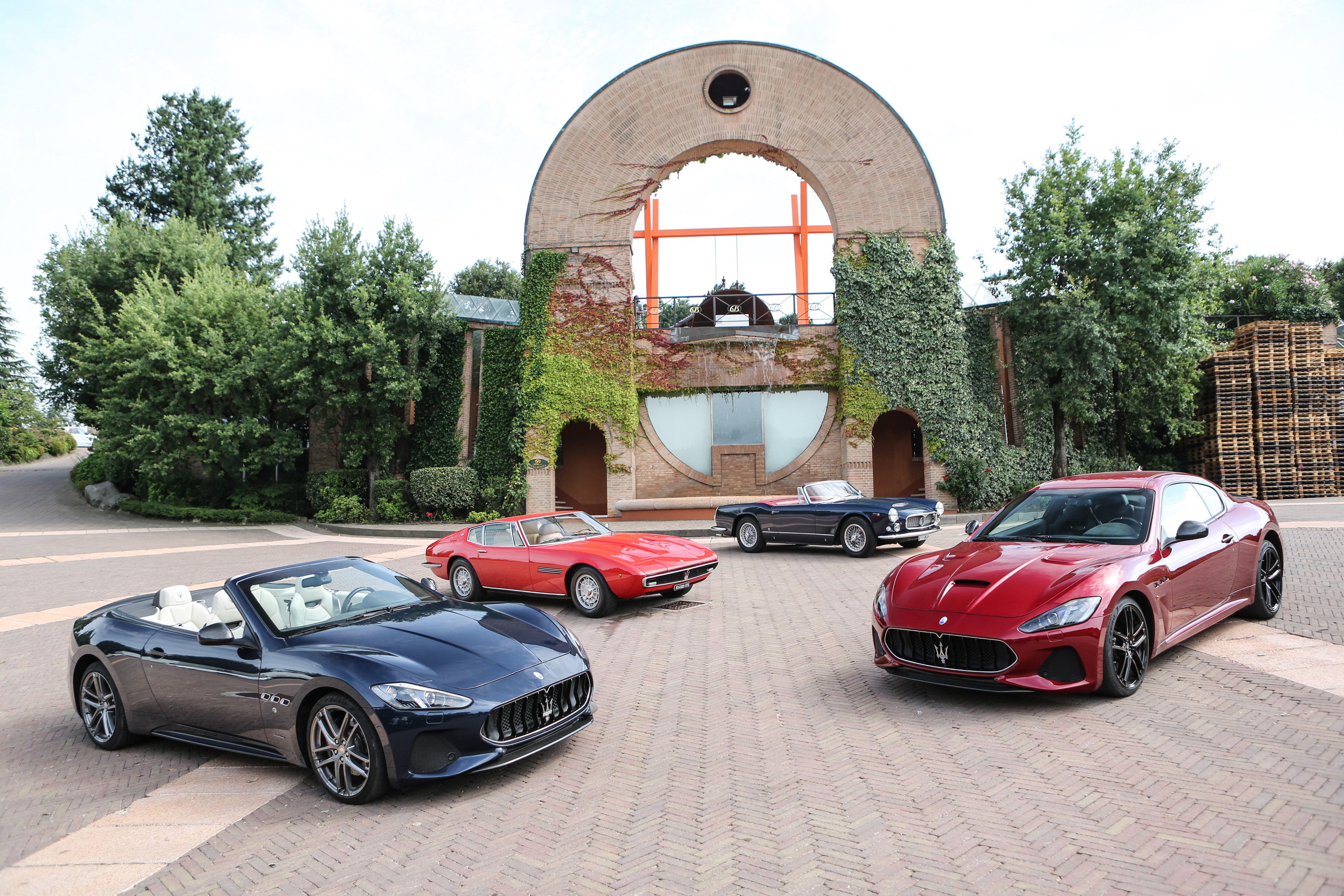 Maserati cars in front of a building HD Wallpaper