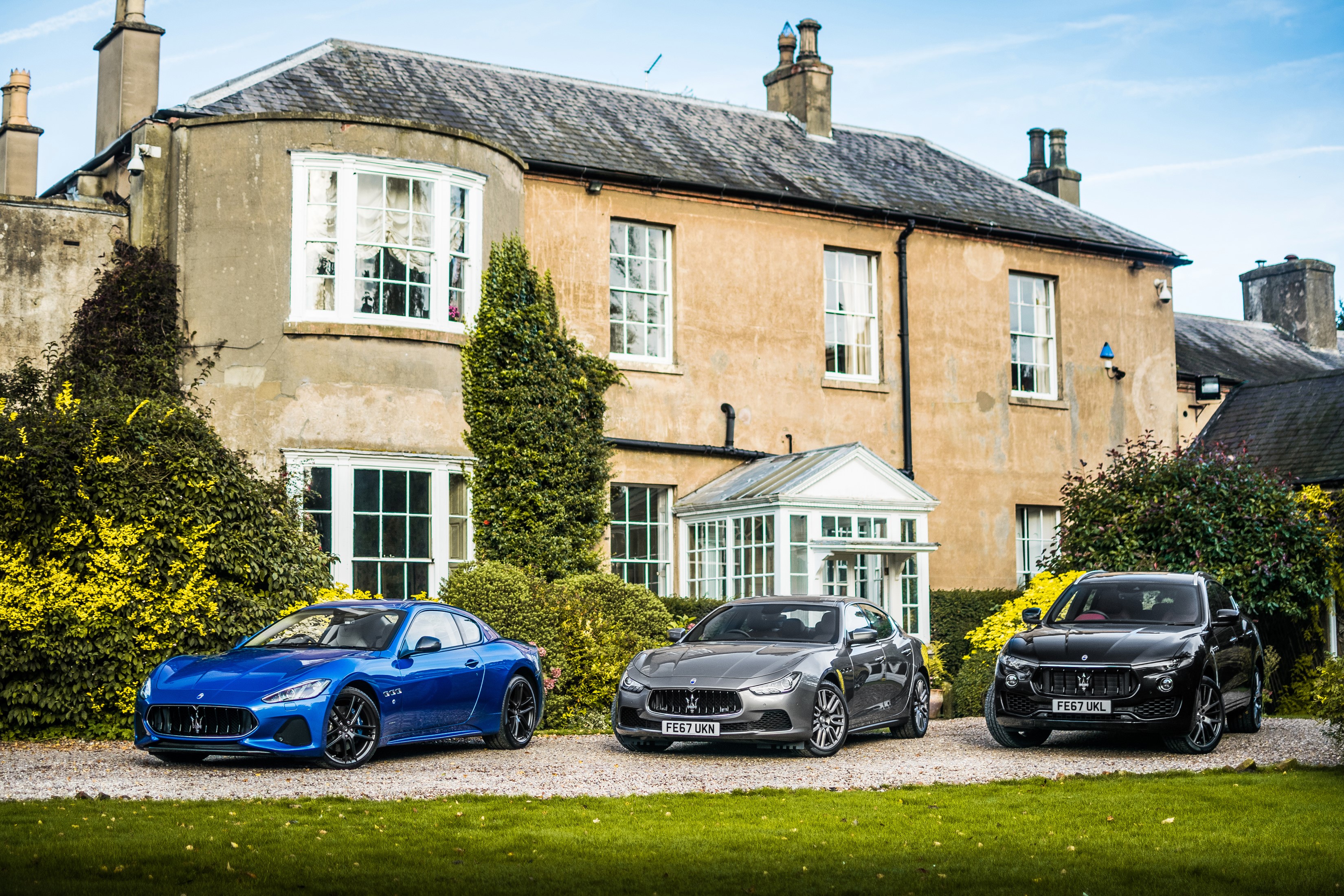 Three Maserati cars parked in front of a house HD Wallpaper