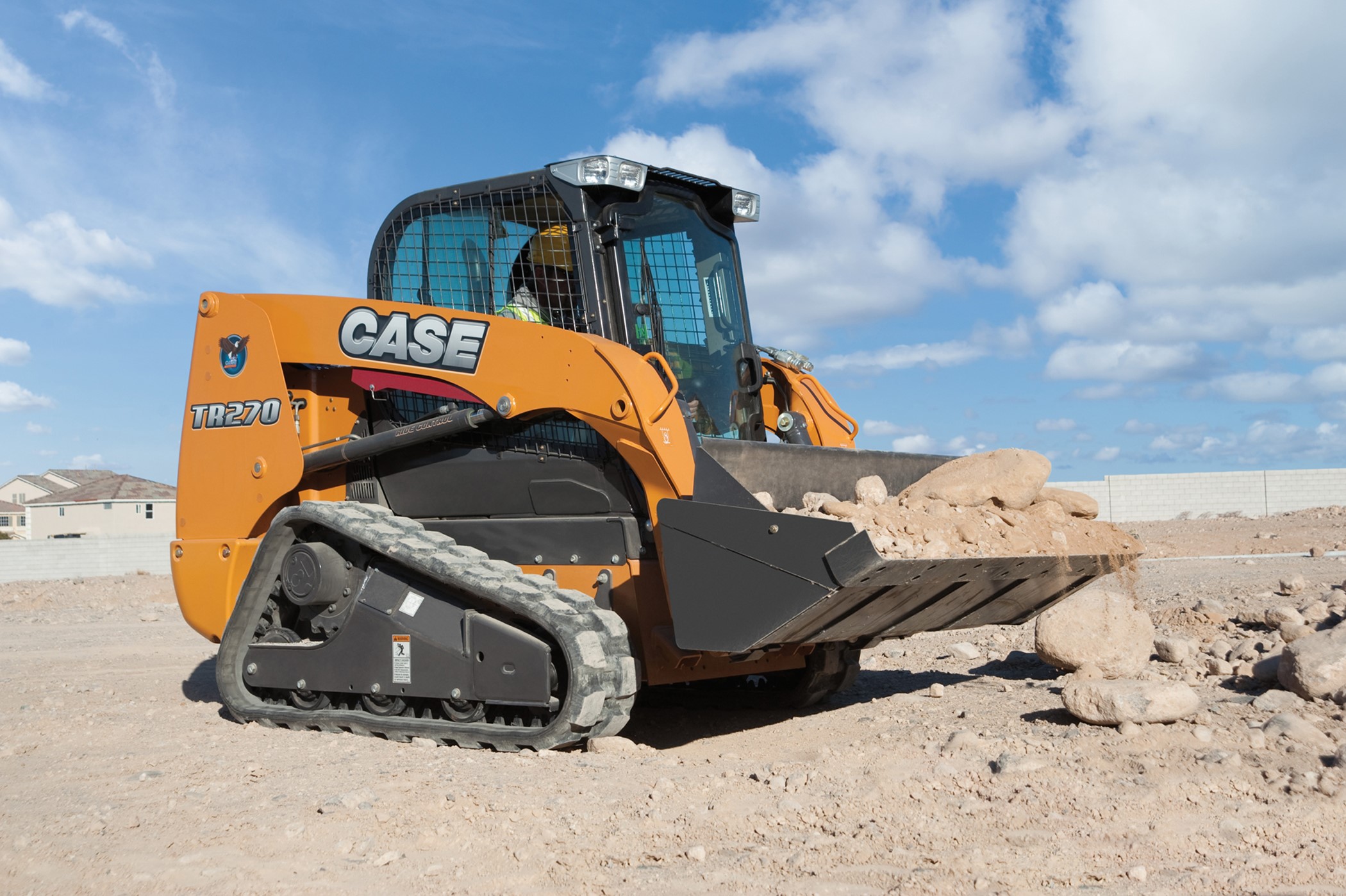 Case TR270 compact track loader with bucket of rocks HD Wallpaper