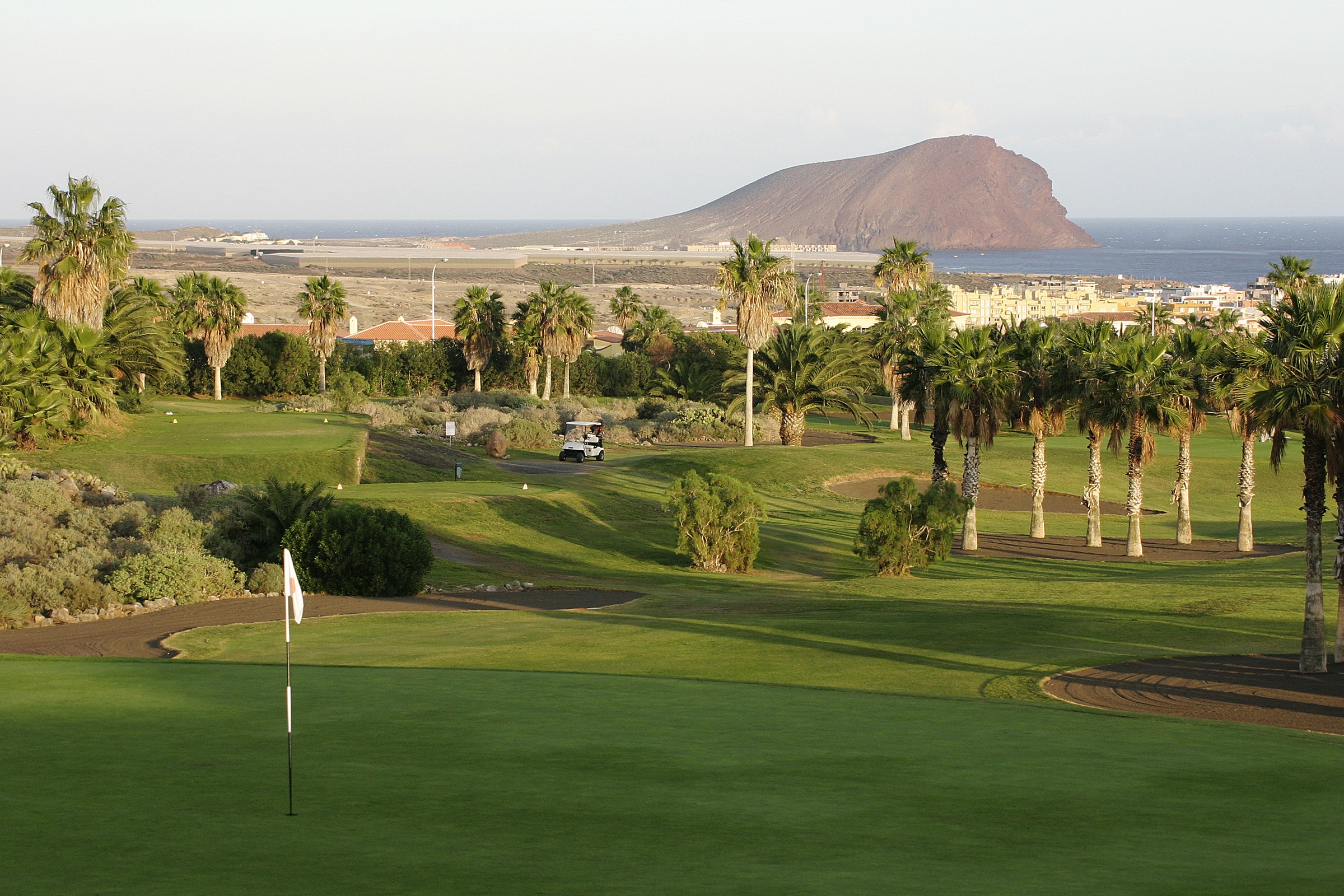 Golf course with palm trees and a mountain in Tenerife HD Wallpaper