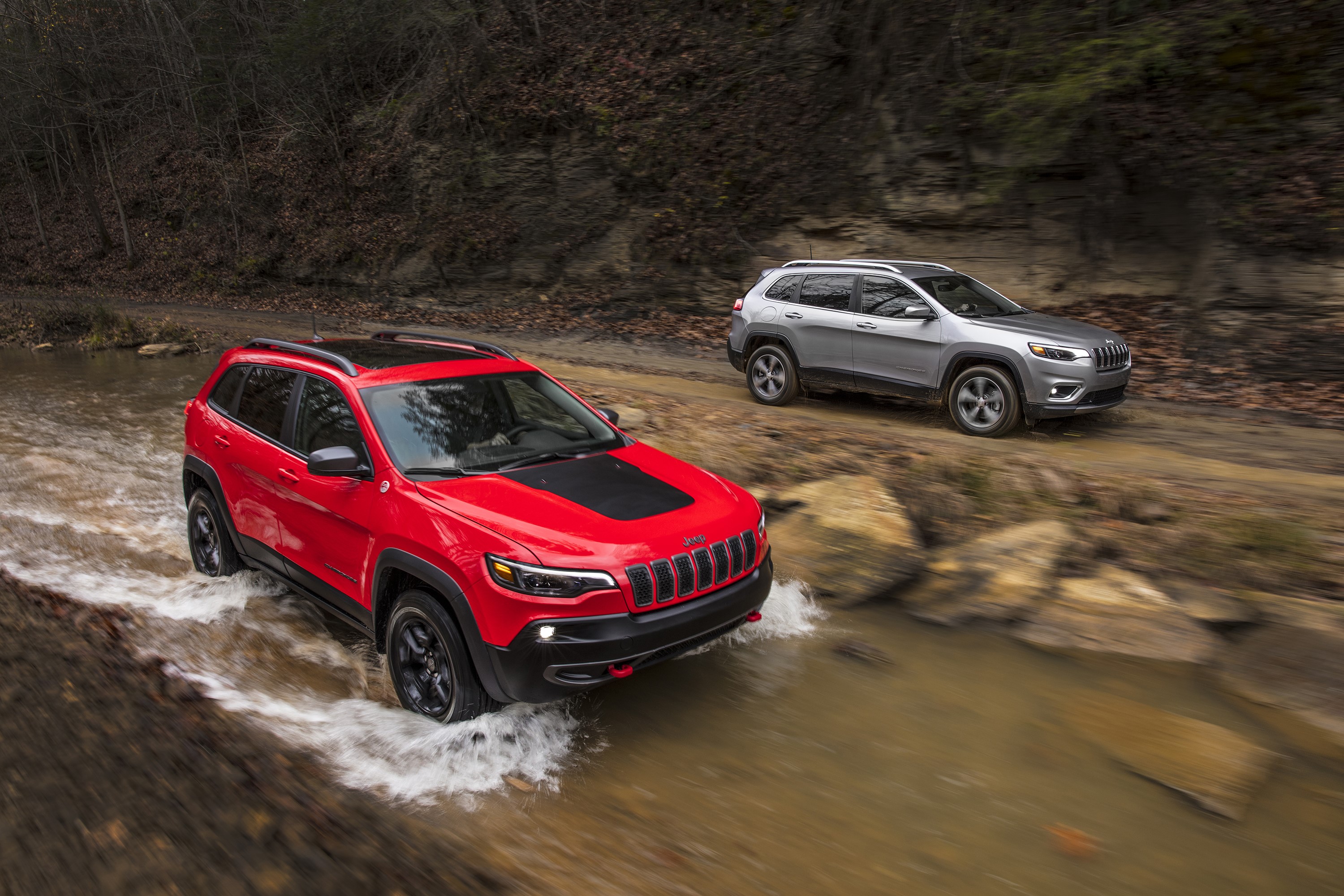 Two Jeep Cherokees driving through water HD Wallpaper