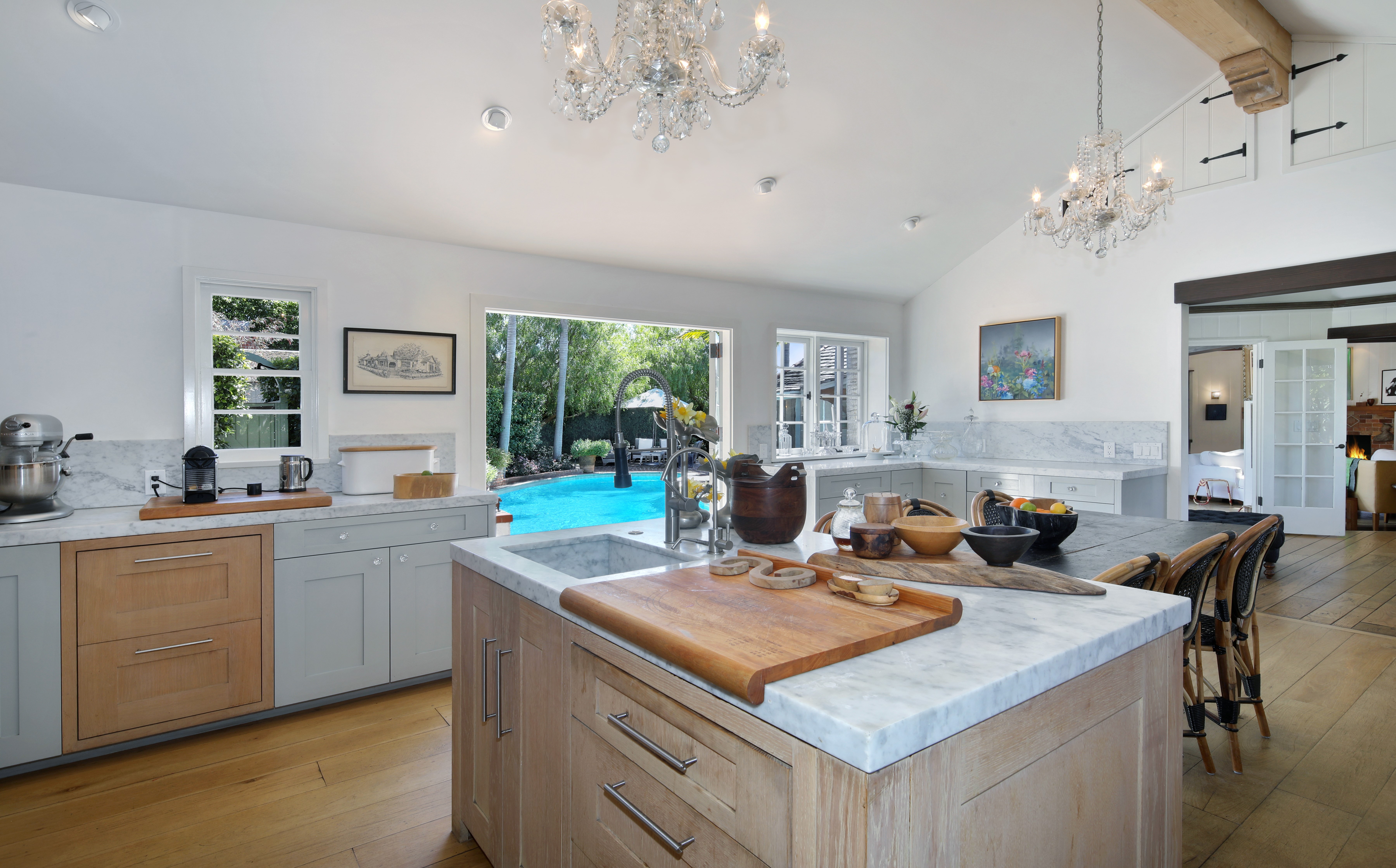 Kitchen with a view of a swimming pool HD Wallpaper