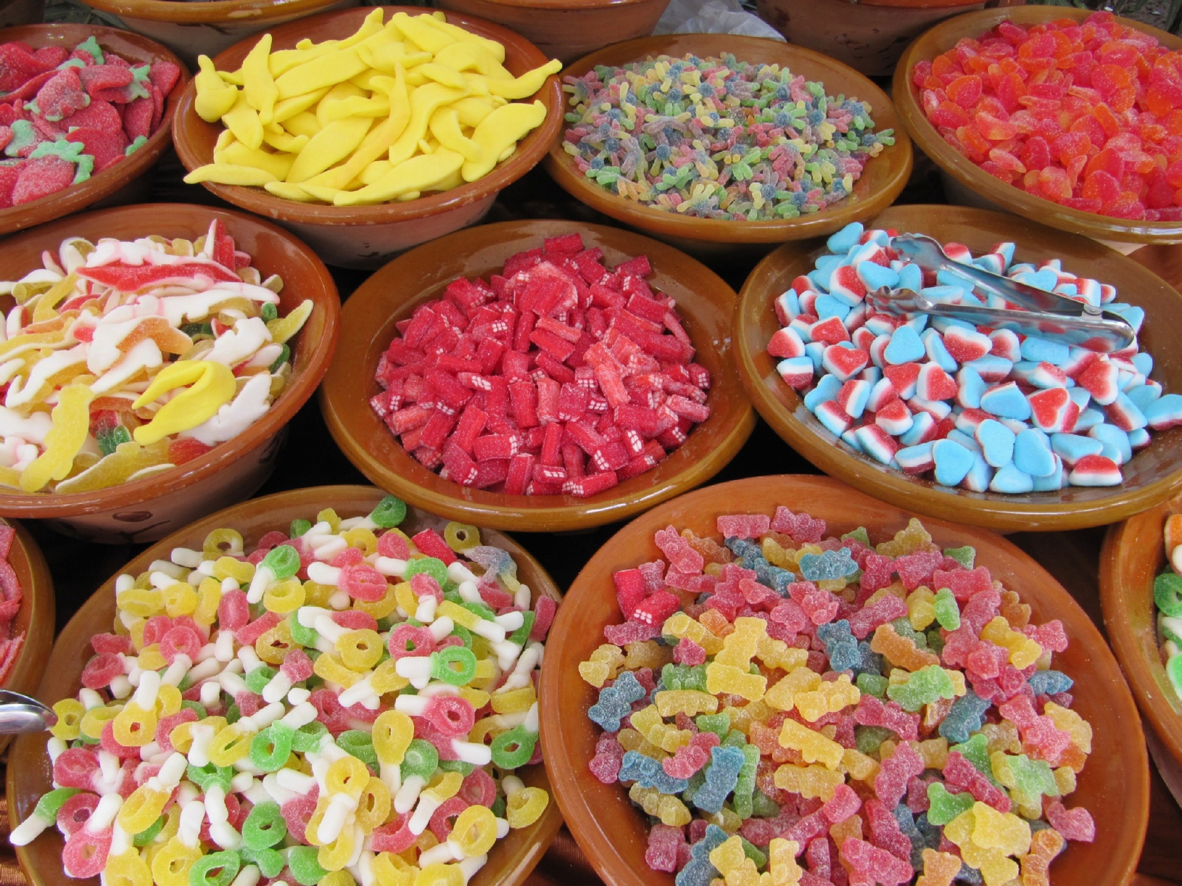 Bowls of assorted colorful gummy candies HD Wallpaper