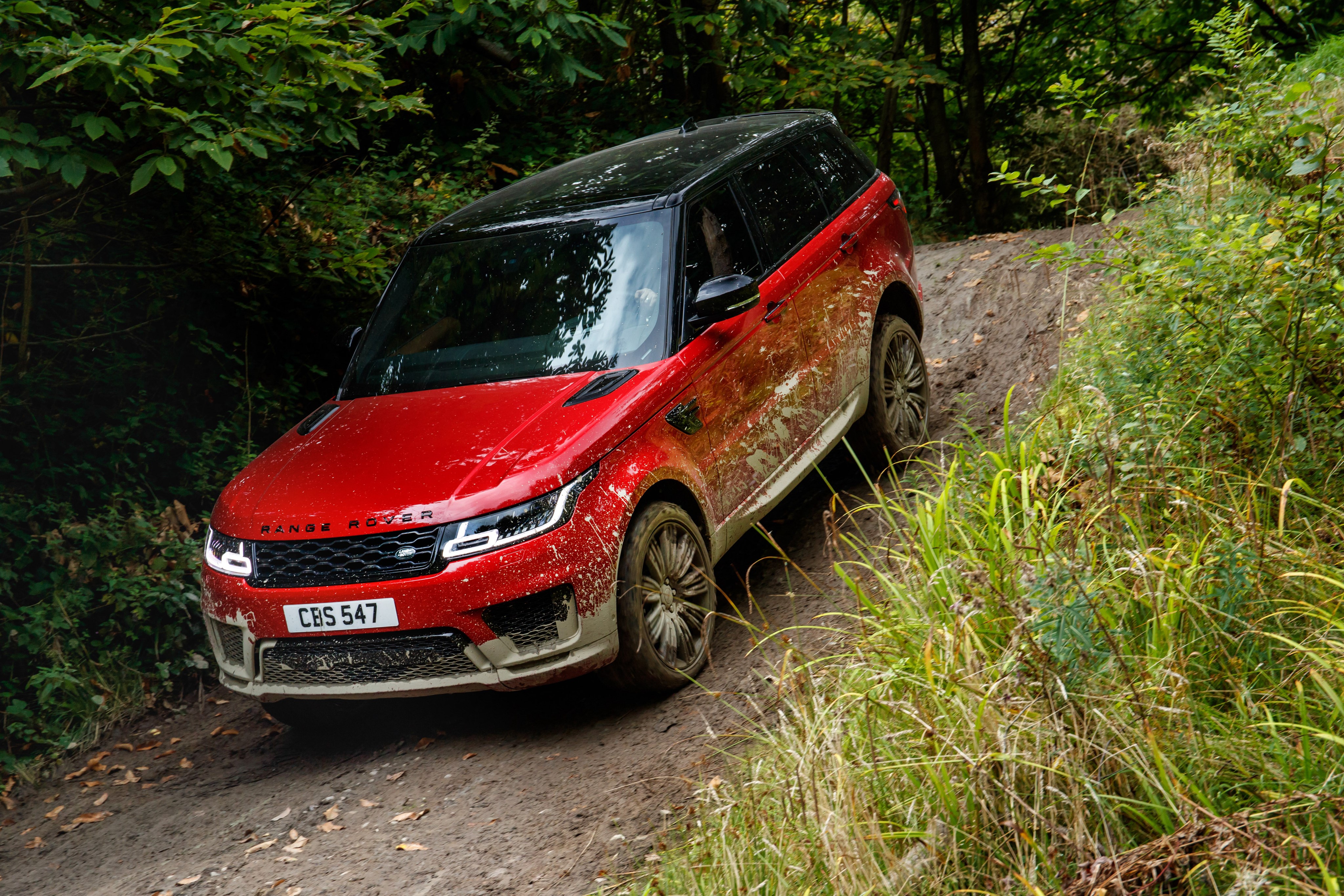 Red Land Rover Sport Autobiography driving off-road HD Wallpaper