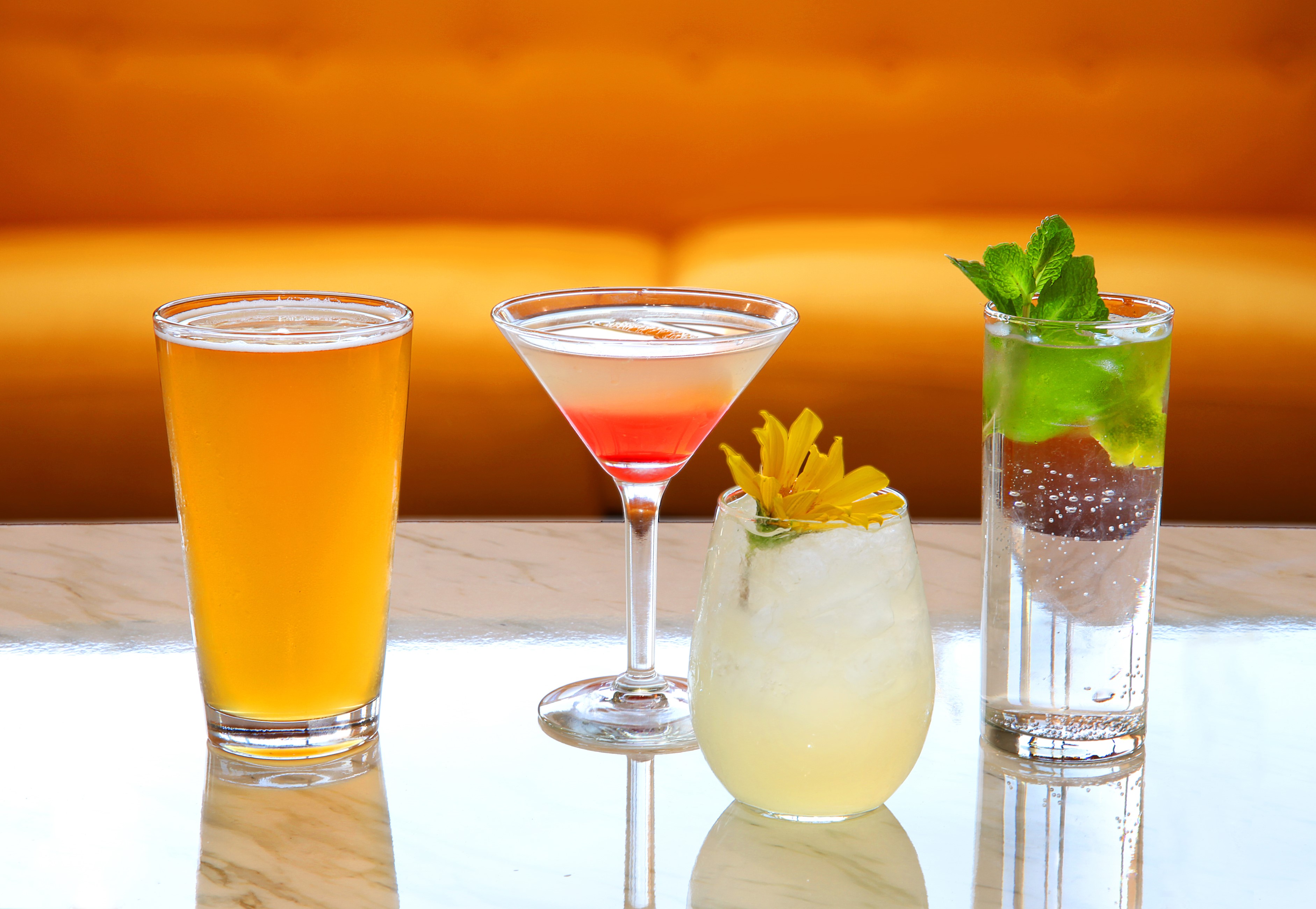 Four assorted drinks on a marble table HD Wallpaper