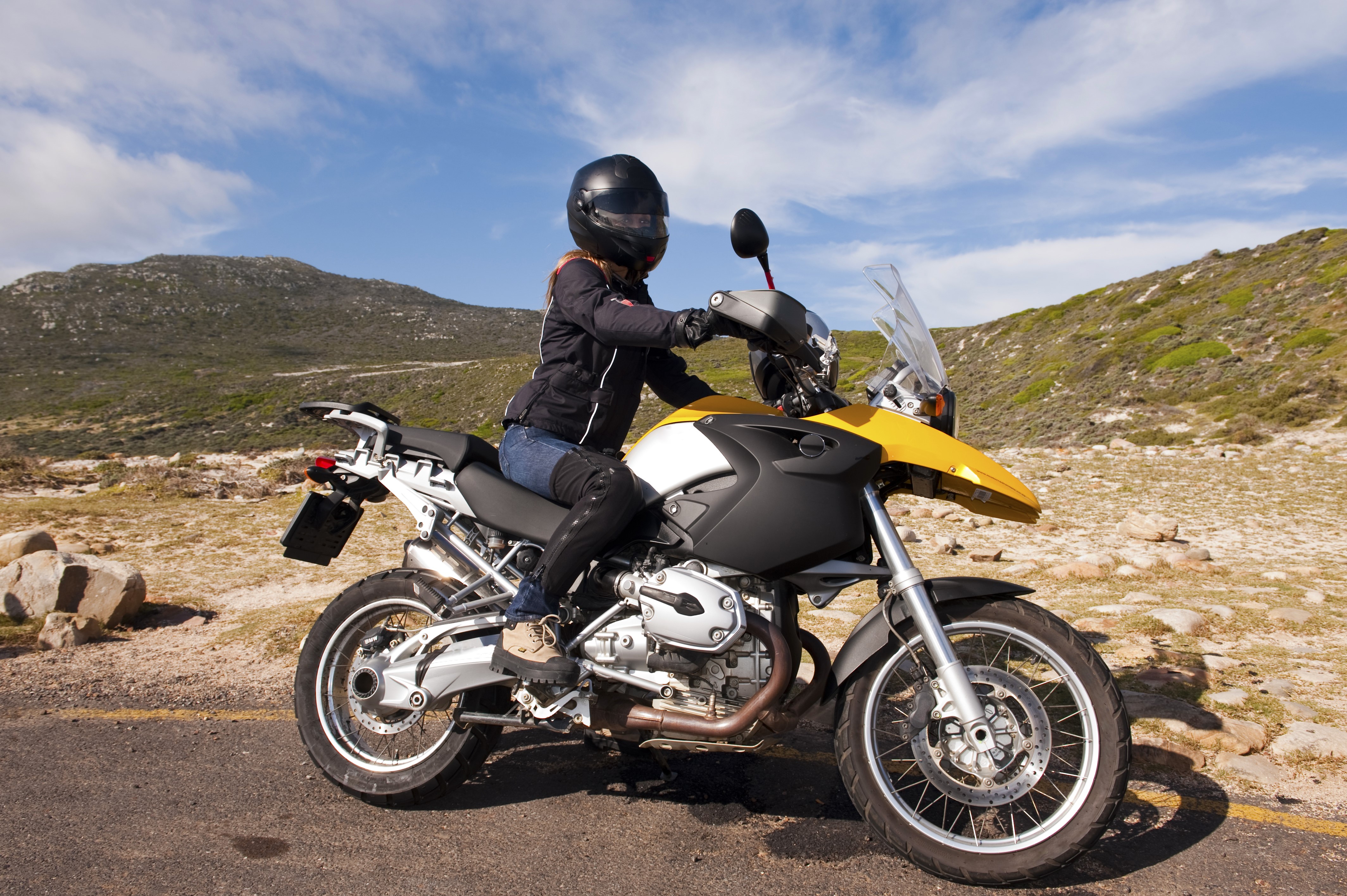 Motorcyclist wearing helmet on yellow motorcycle HD Wallpaper