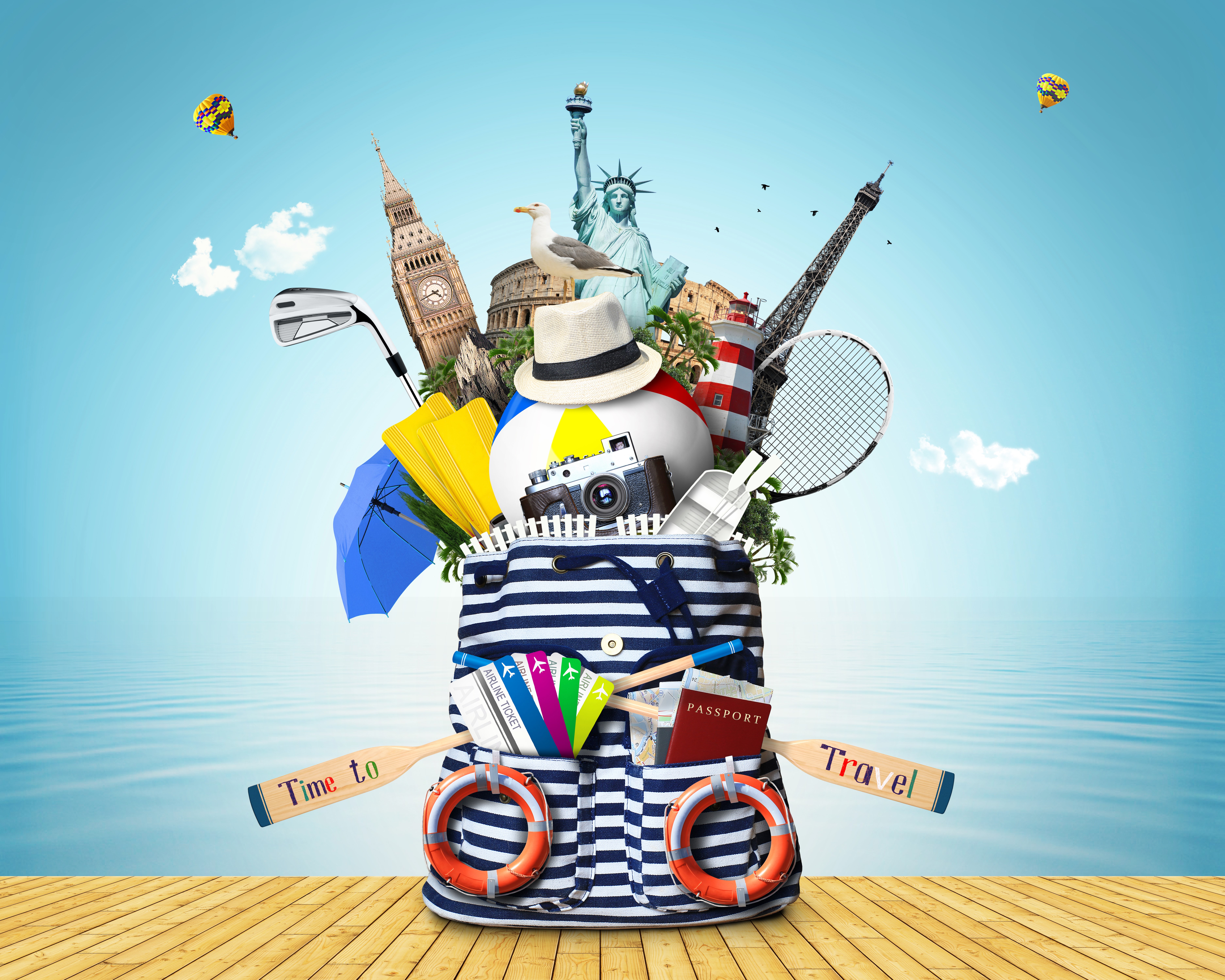 Travel bag with landmarks and beach items HD Wallpaper