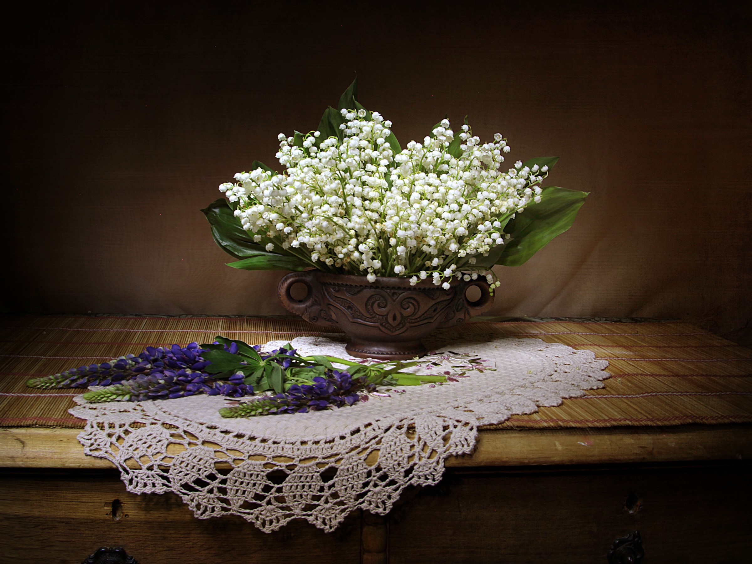 Lily of the valley and lupine flowers in a vase on a table HD Wallpaper