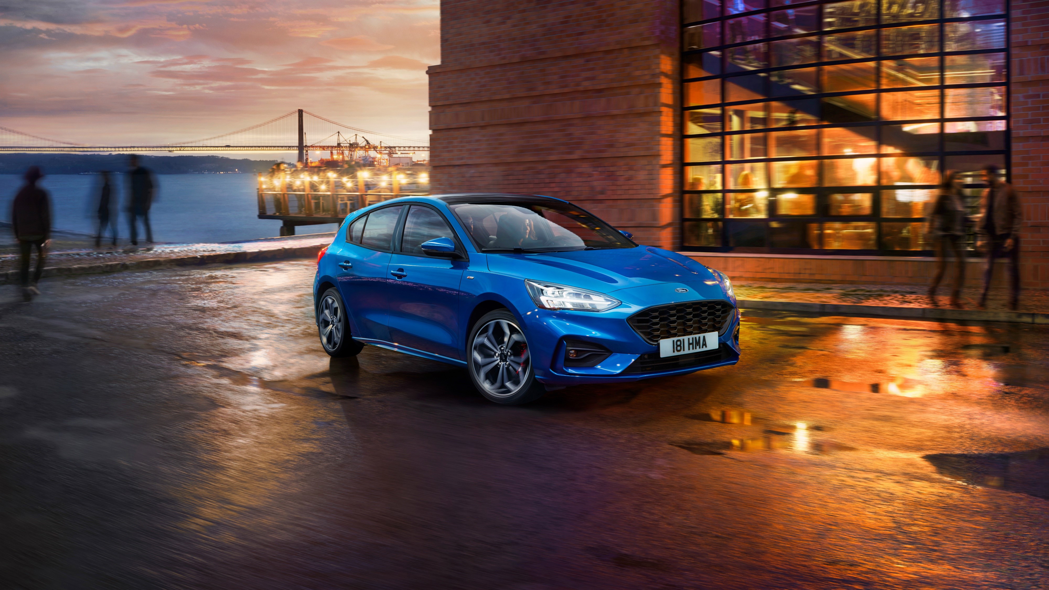 Blue Ford Focus ST Line by a waterfront at dusk HD Wallpaper