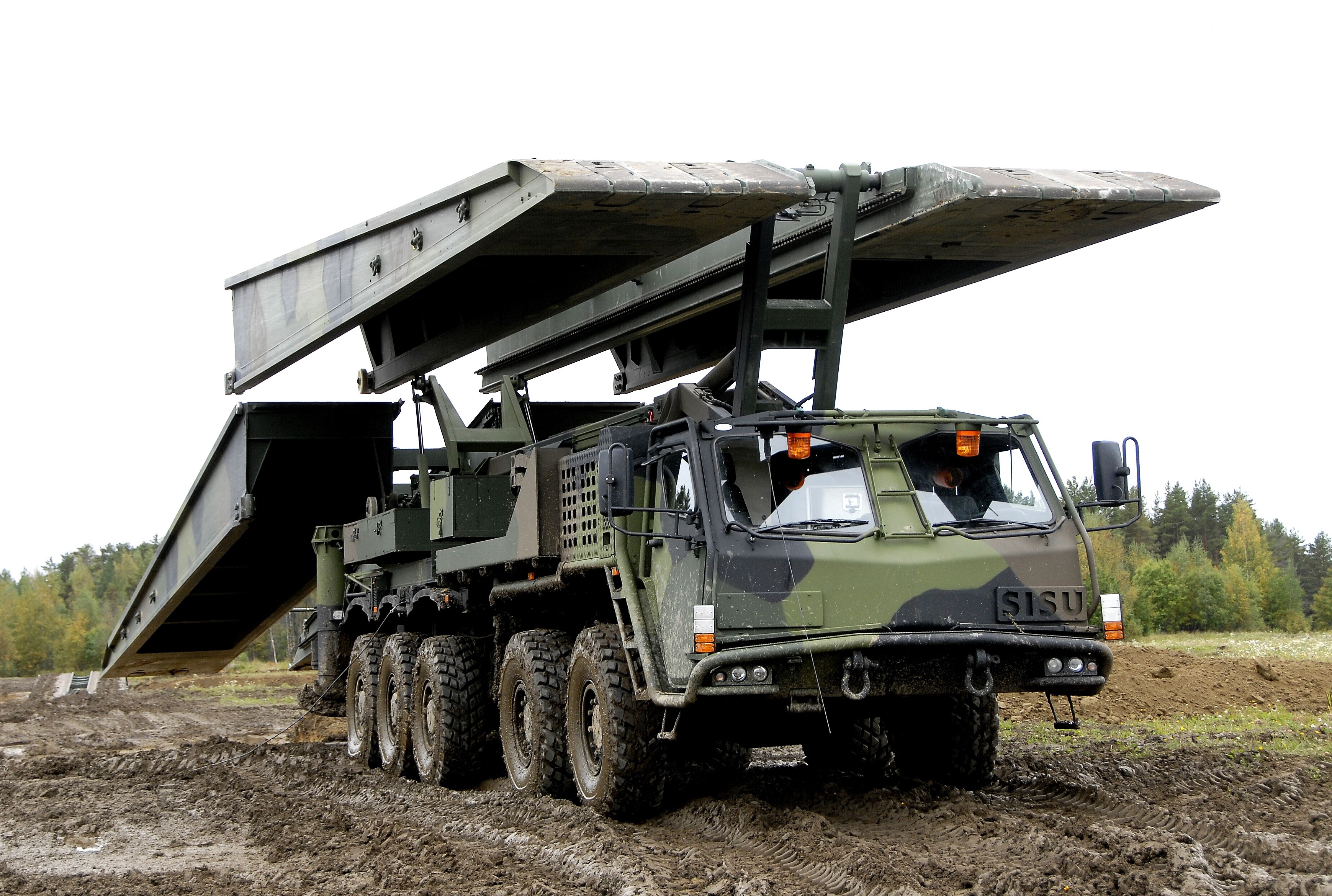 Sisu military bridge-laying truck in muddy terrain HD Wallpaper