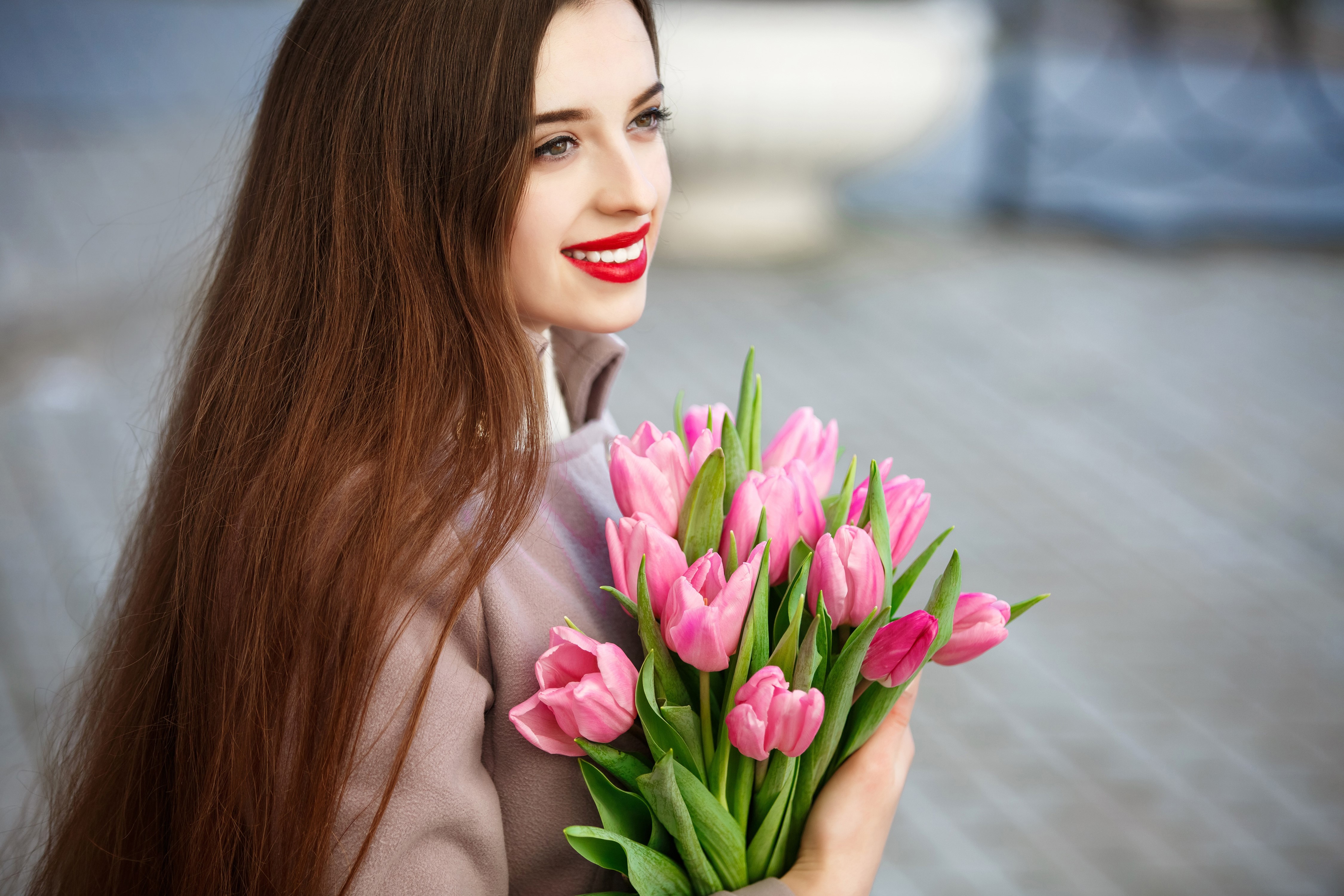 Woman with Brown Hair Holding Pink Tulips HD Wallpaper