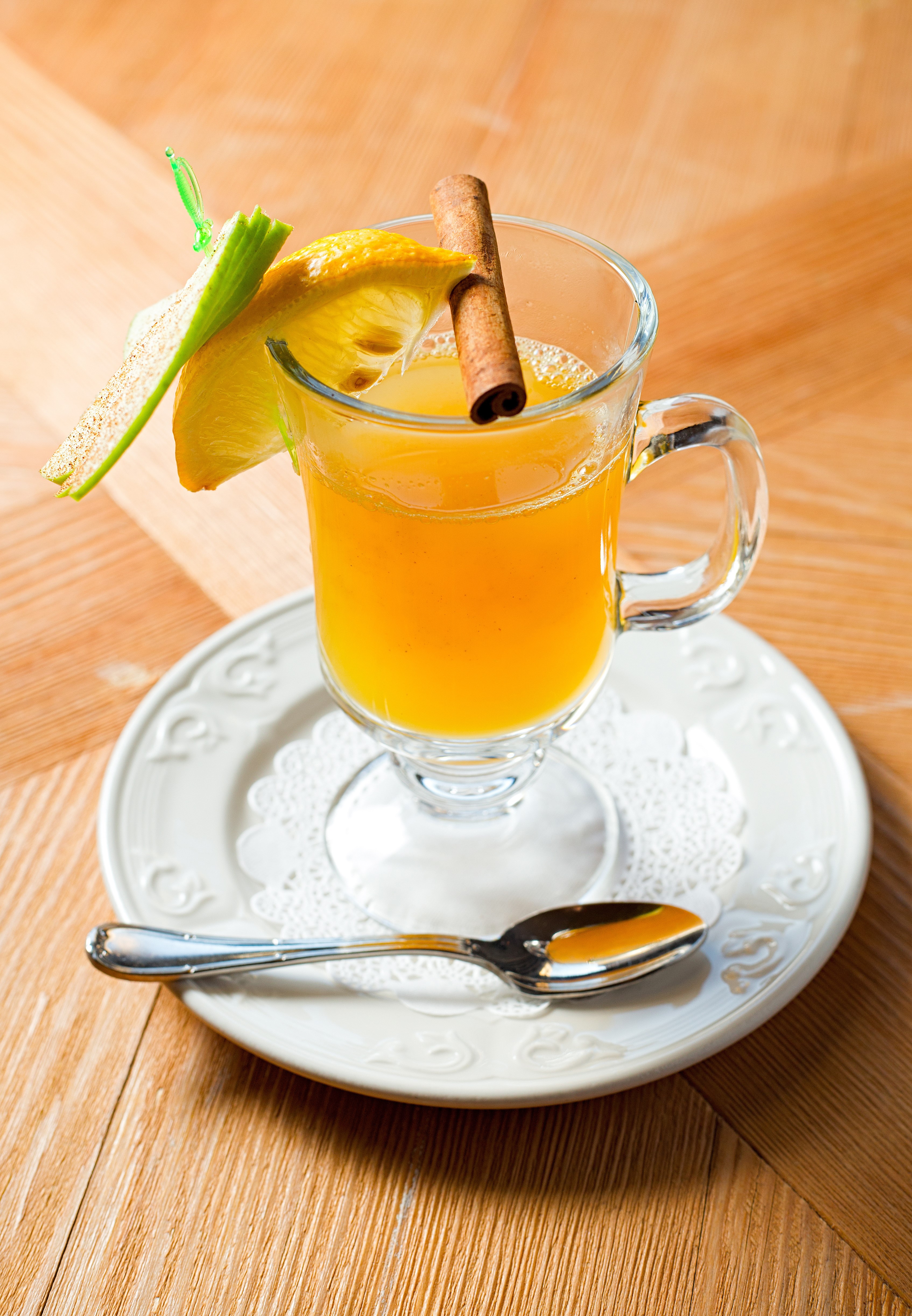 Hot drink with lemon and cinnamon stick HD Phone Wallpaper