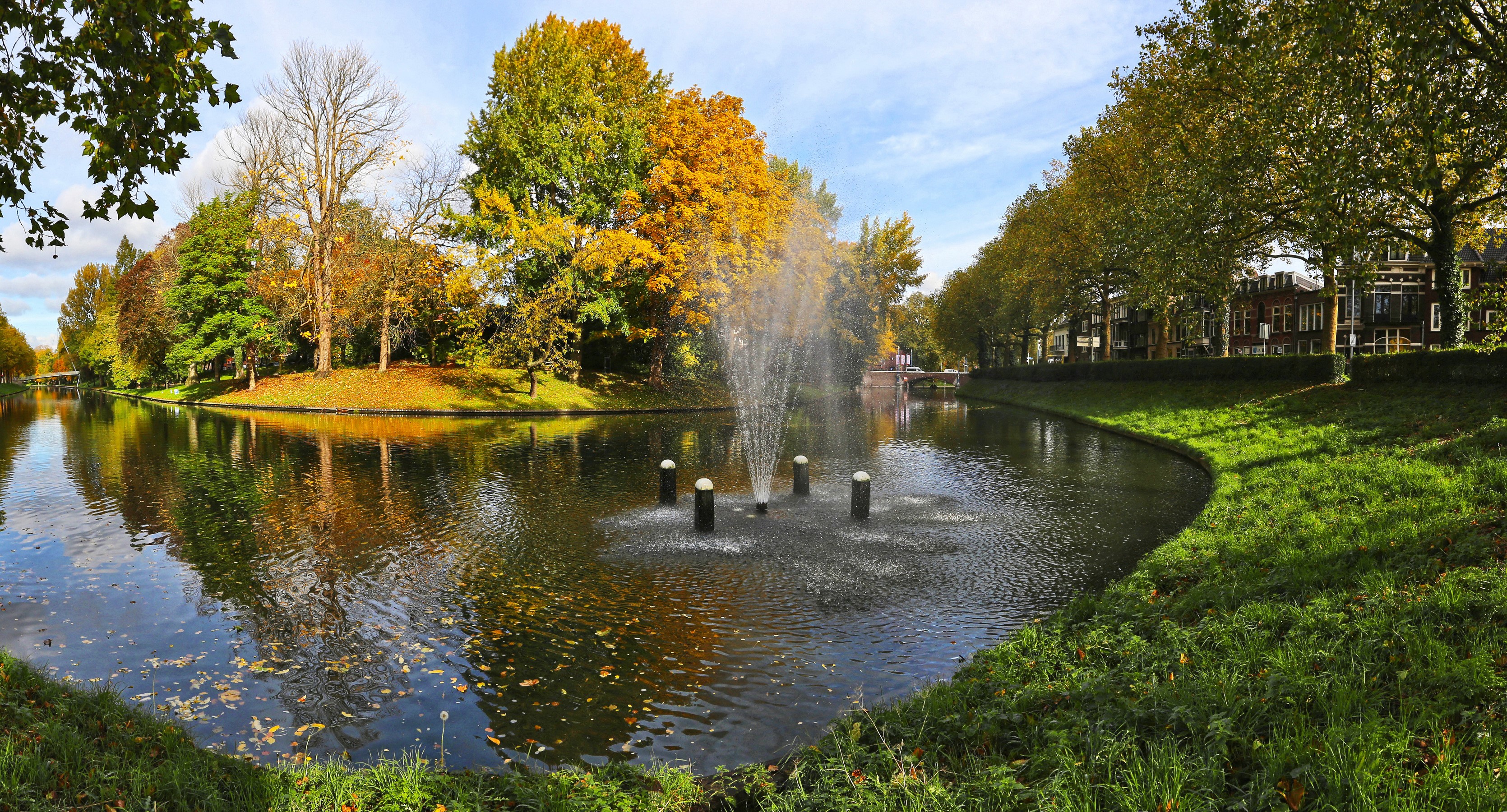 Canal with fountain and autumn trees in Utrecht, Netherlands HD Wallpaper