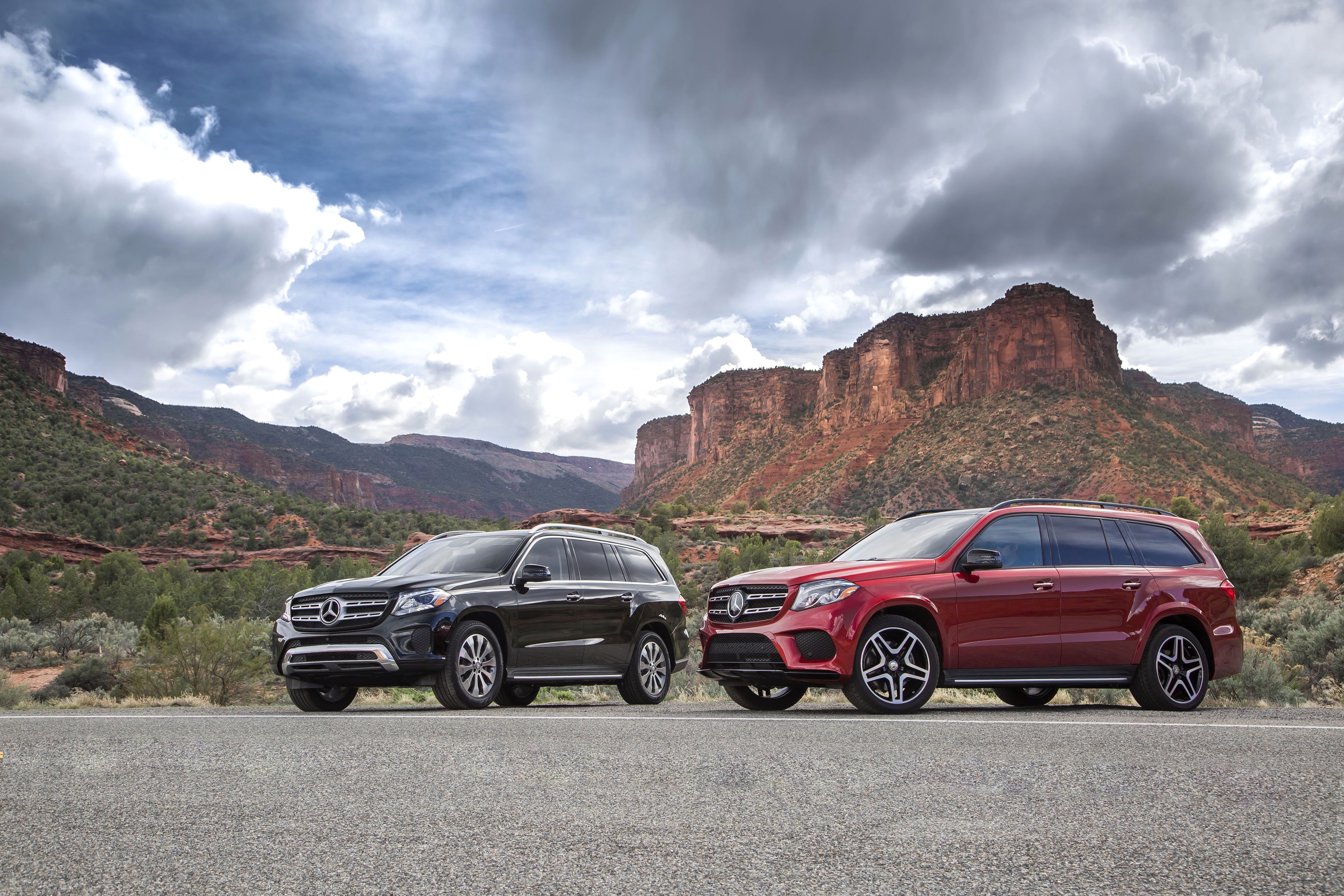 Two Mercedes-Benz GLS-Klasse SUVs in a Mountainous Landscape HD Wallpaper