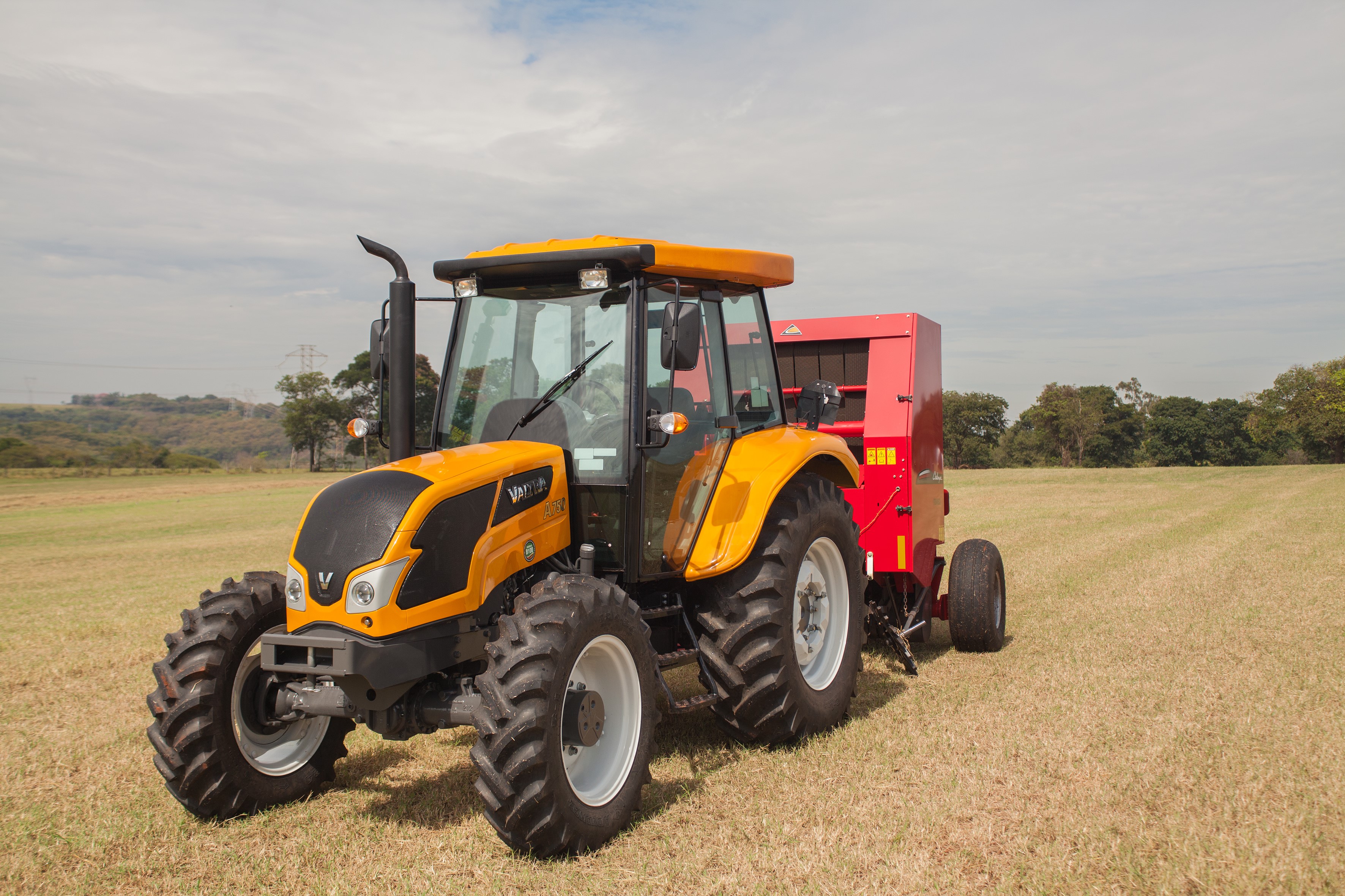 Valtra A750 Cab tractor with baler in a field HD Wallpaper