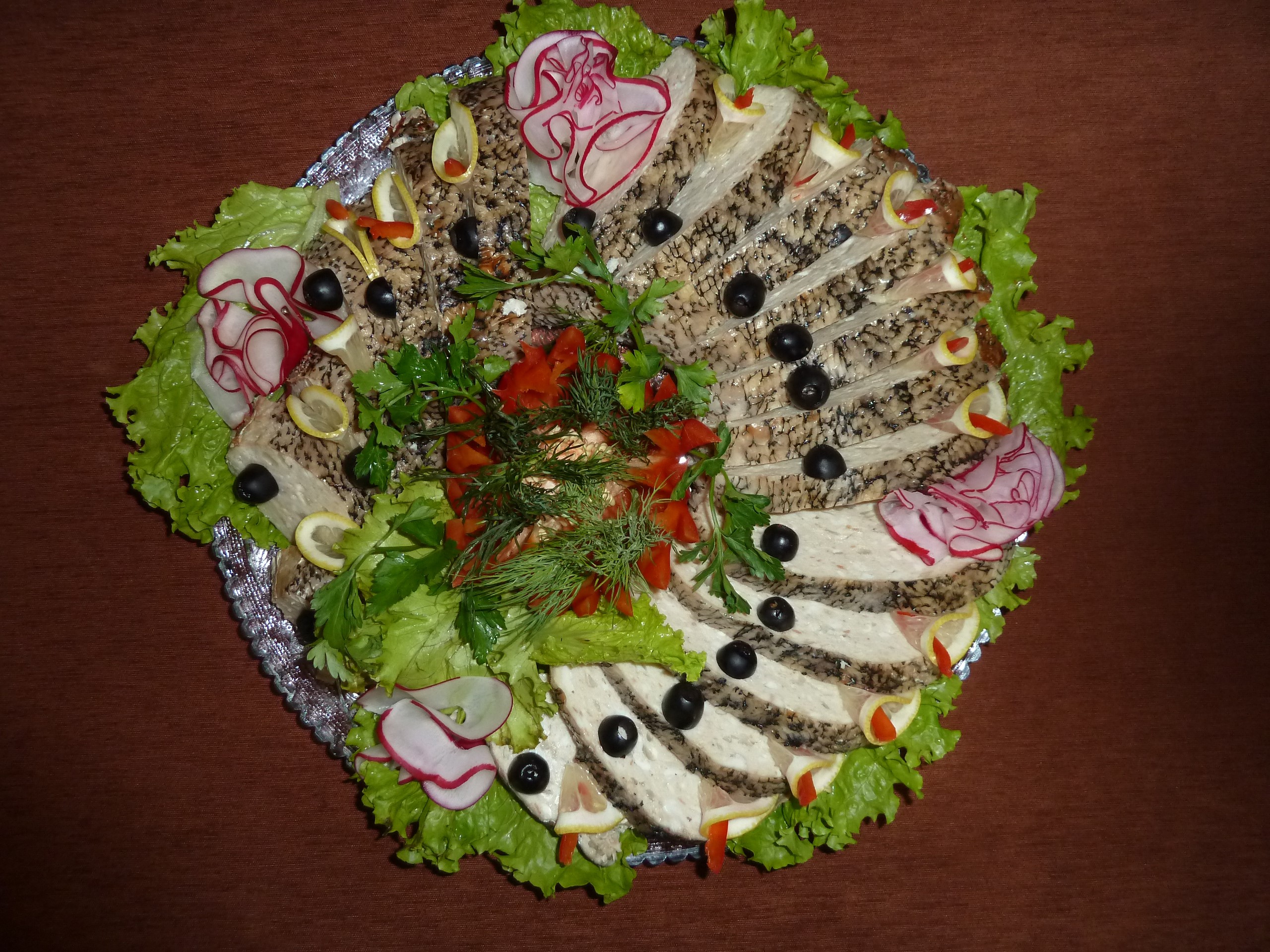 Sliced fish platter with olives, radishes, and lemon HD Wallpaper