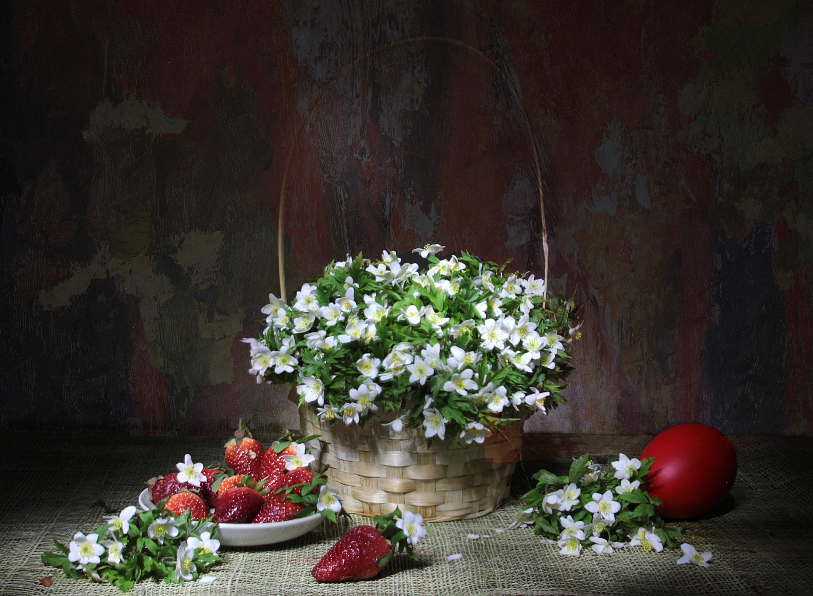 Strawberries and anemones in a wicker basket with a red egg HD Wallpaper