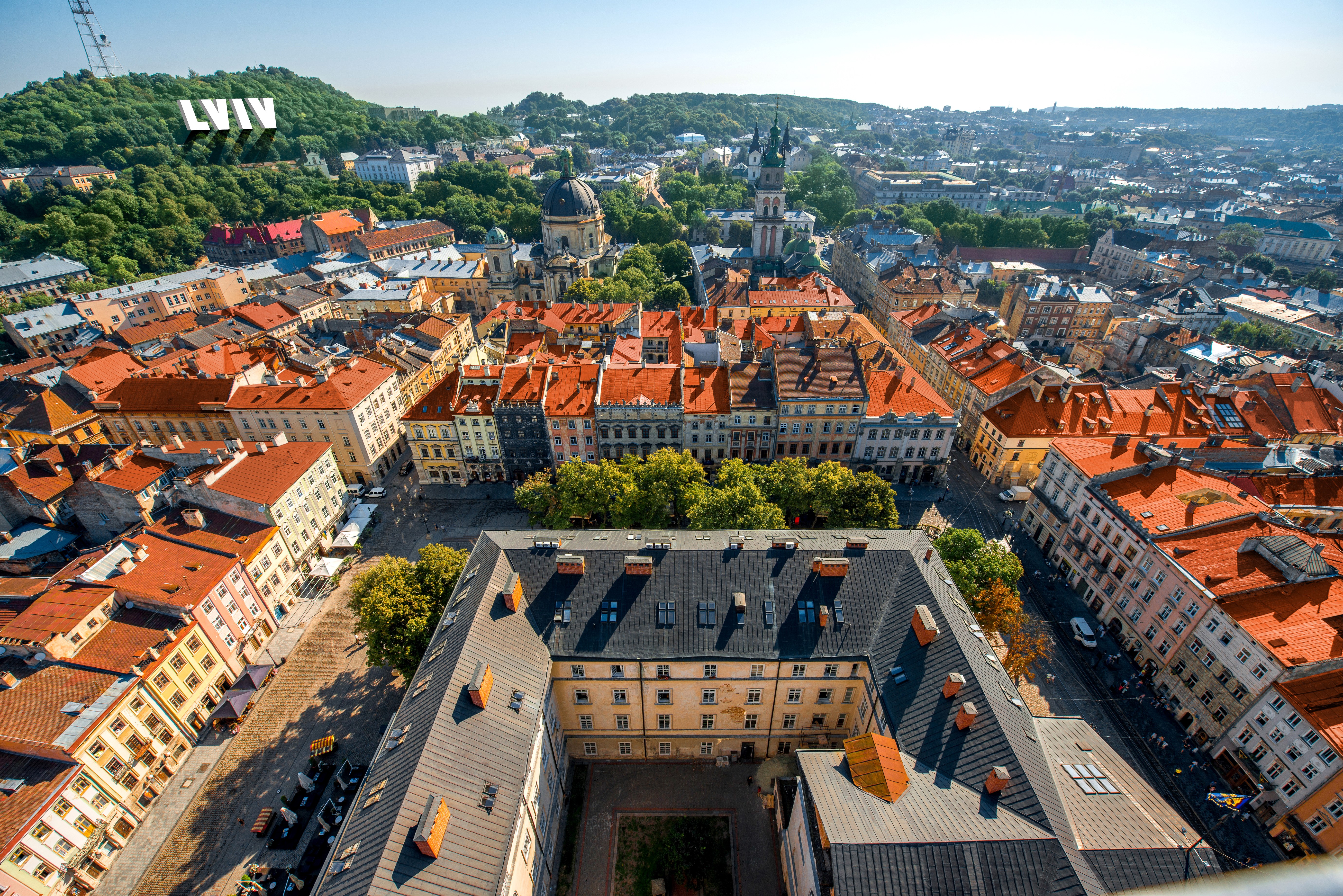 Lviv city skyline with red roofs from above HD Wallpaper