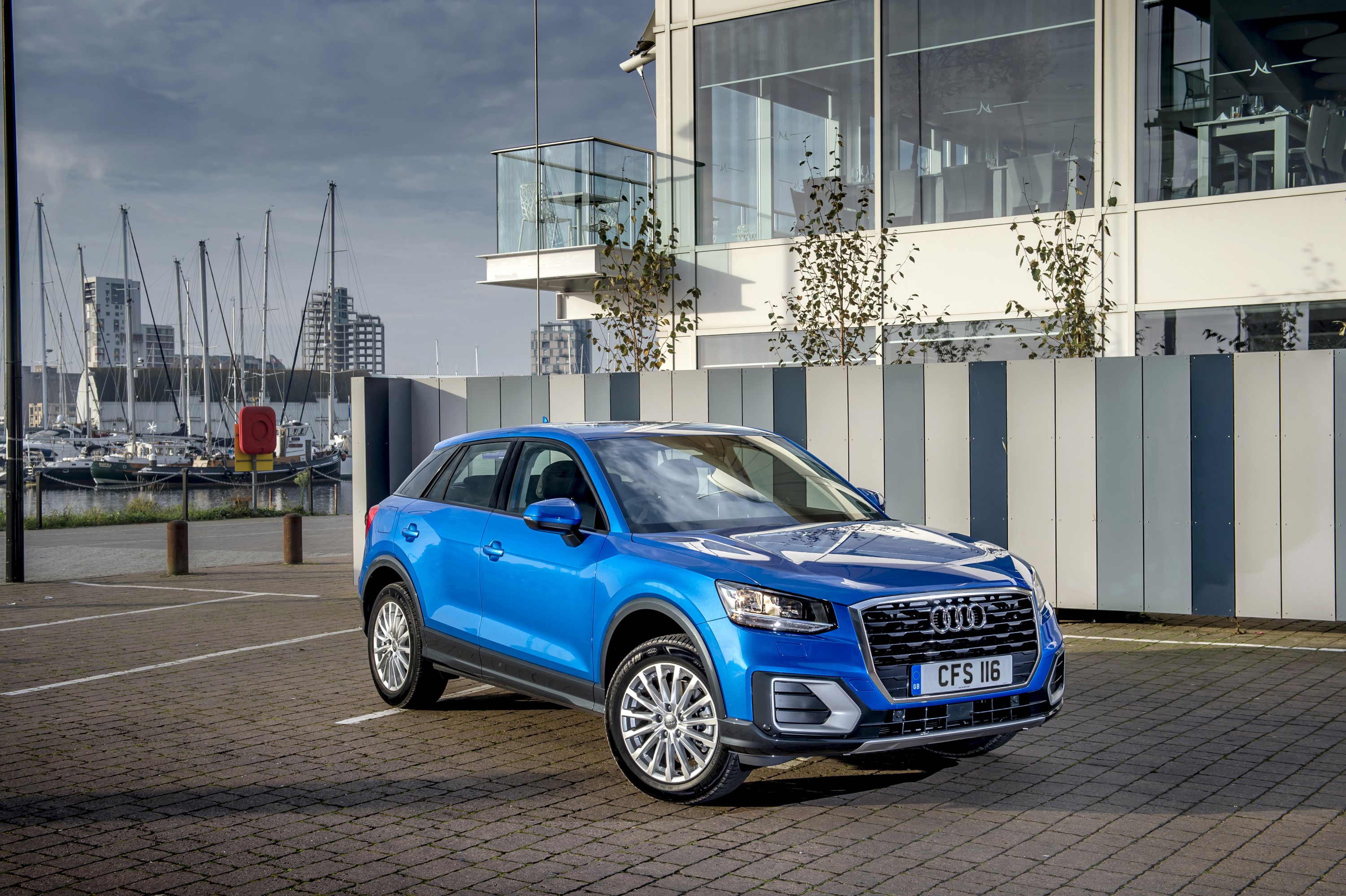 Blue Audi Q2 TDI parked in a marina HD Wallpaper