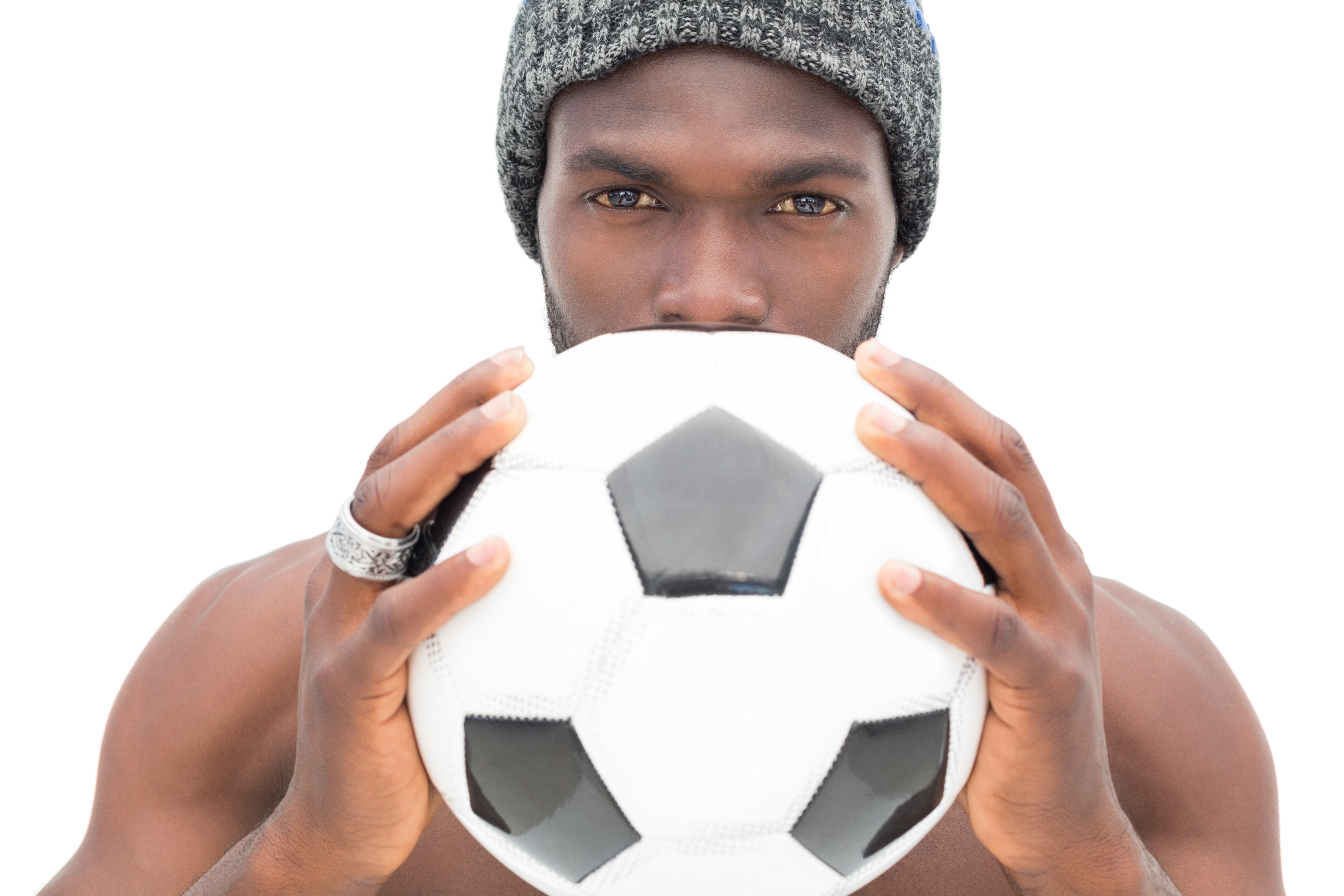 Man in beanie holding a soccer ball HD Wallpaper
