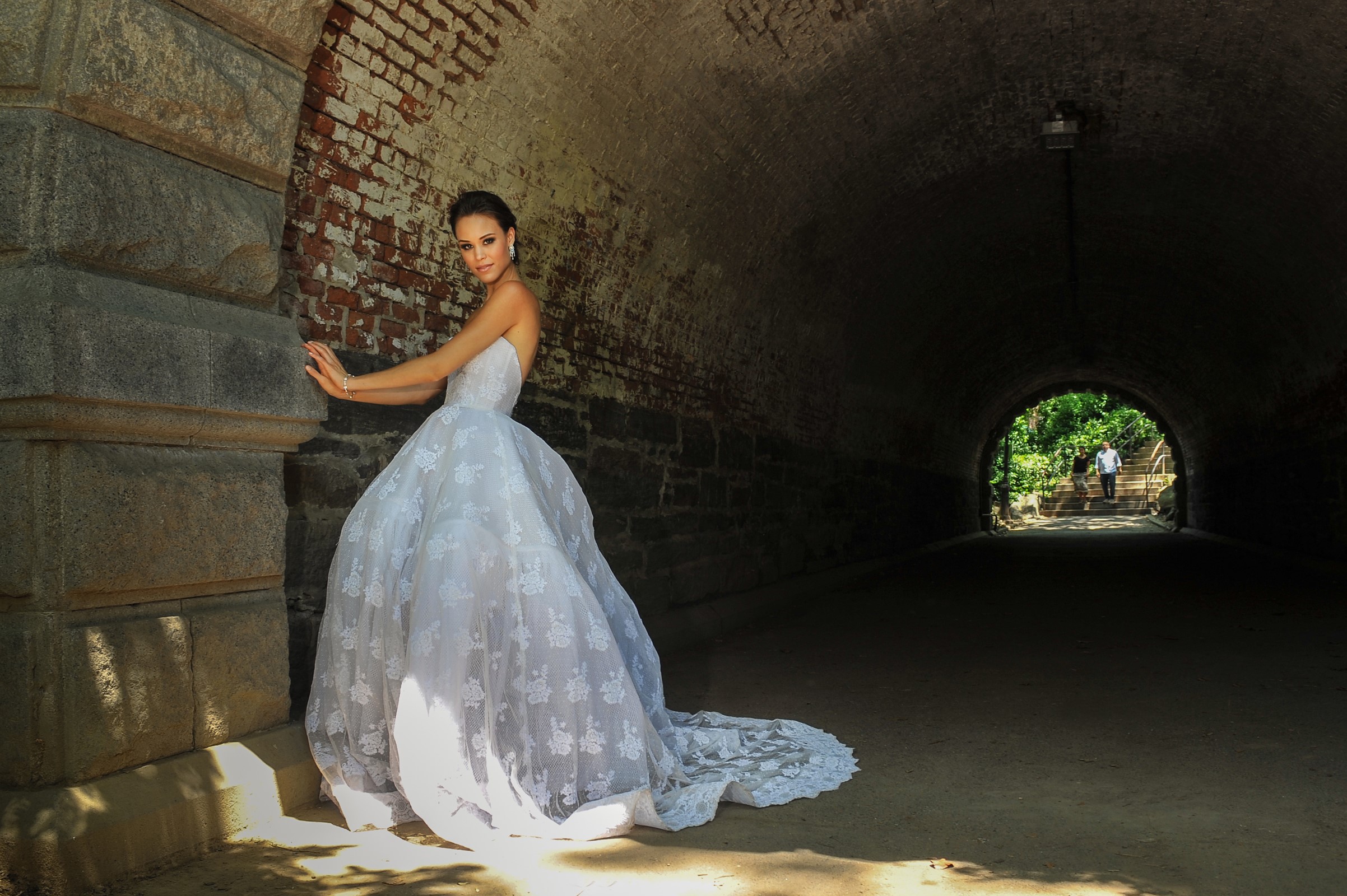 Bride in a white dress in a tunnel HD Wallpaper