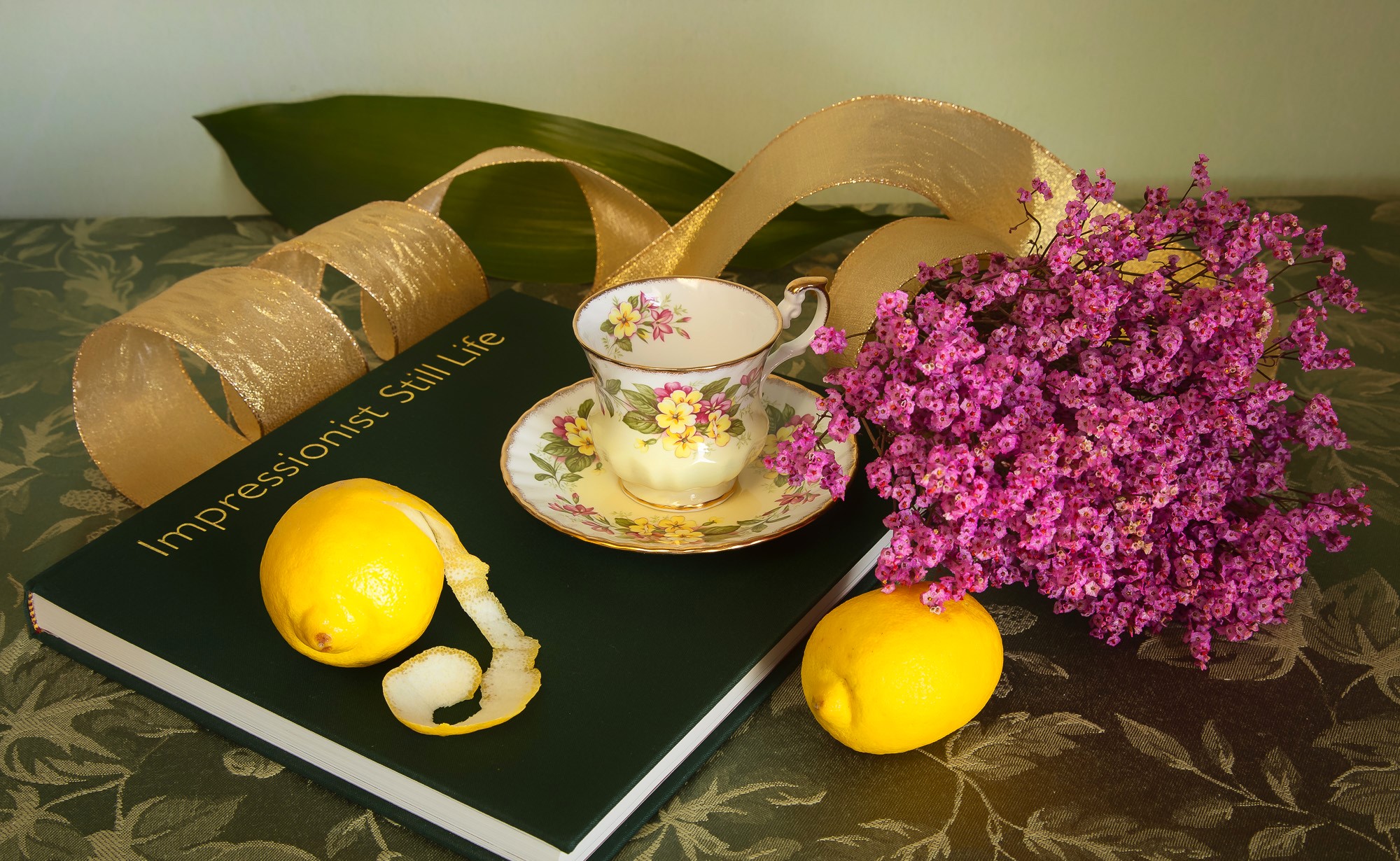 Still-life with lemons, cup, and book HD Wallpaper