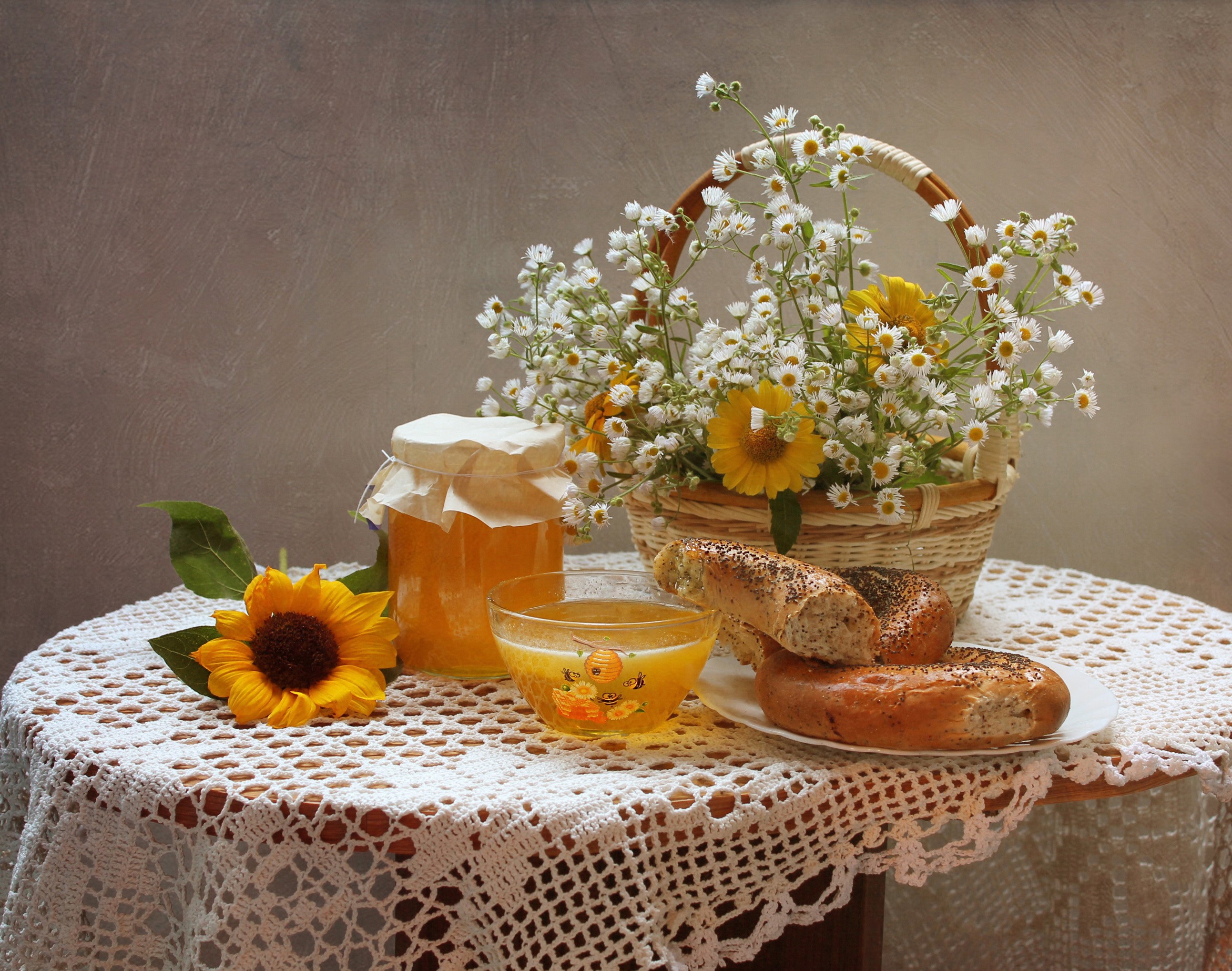 Still life with sunflowers, honey, and bagels HD Wallpaper