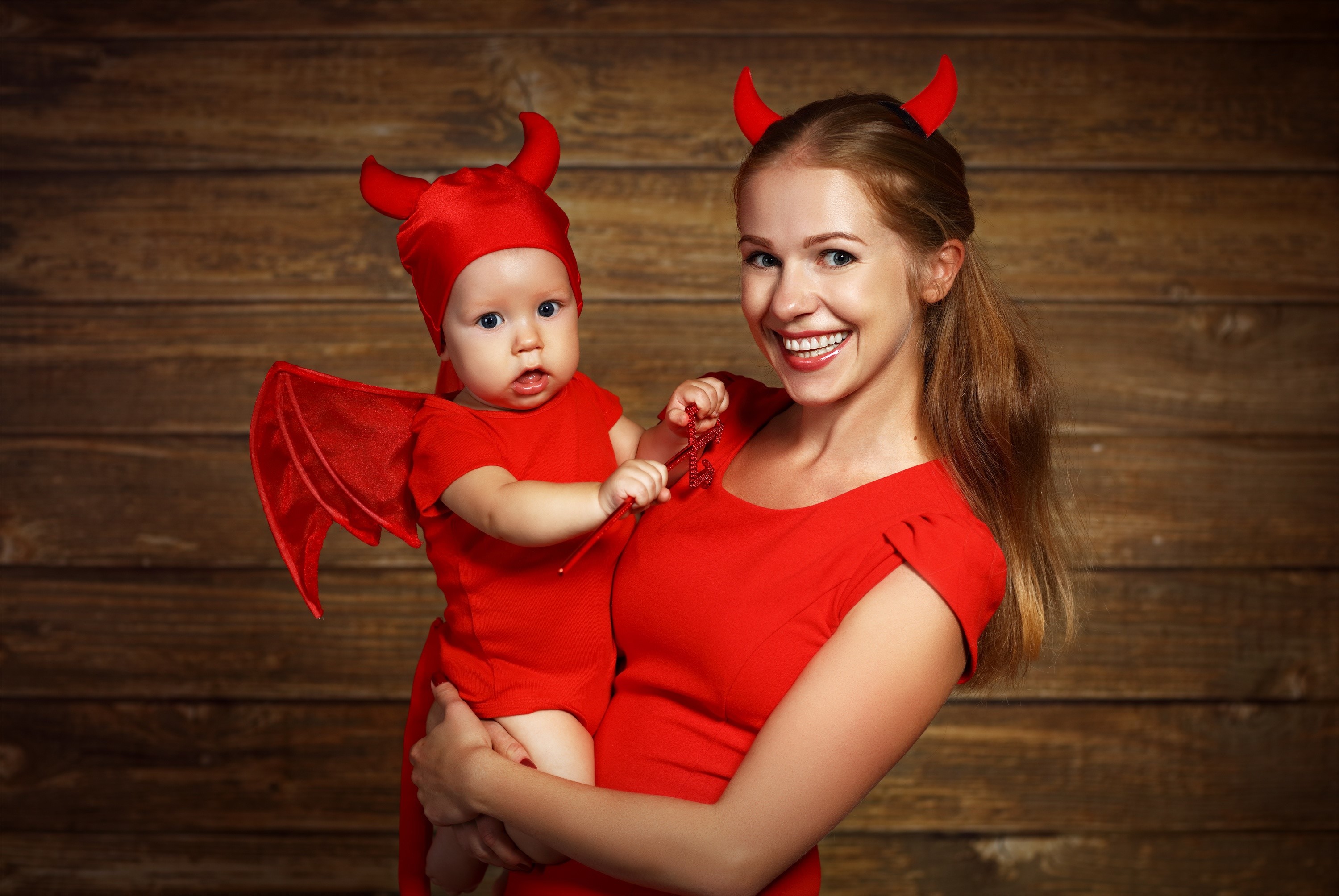 Mother and baby in devil costumes HD Wallpaper