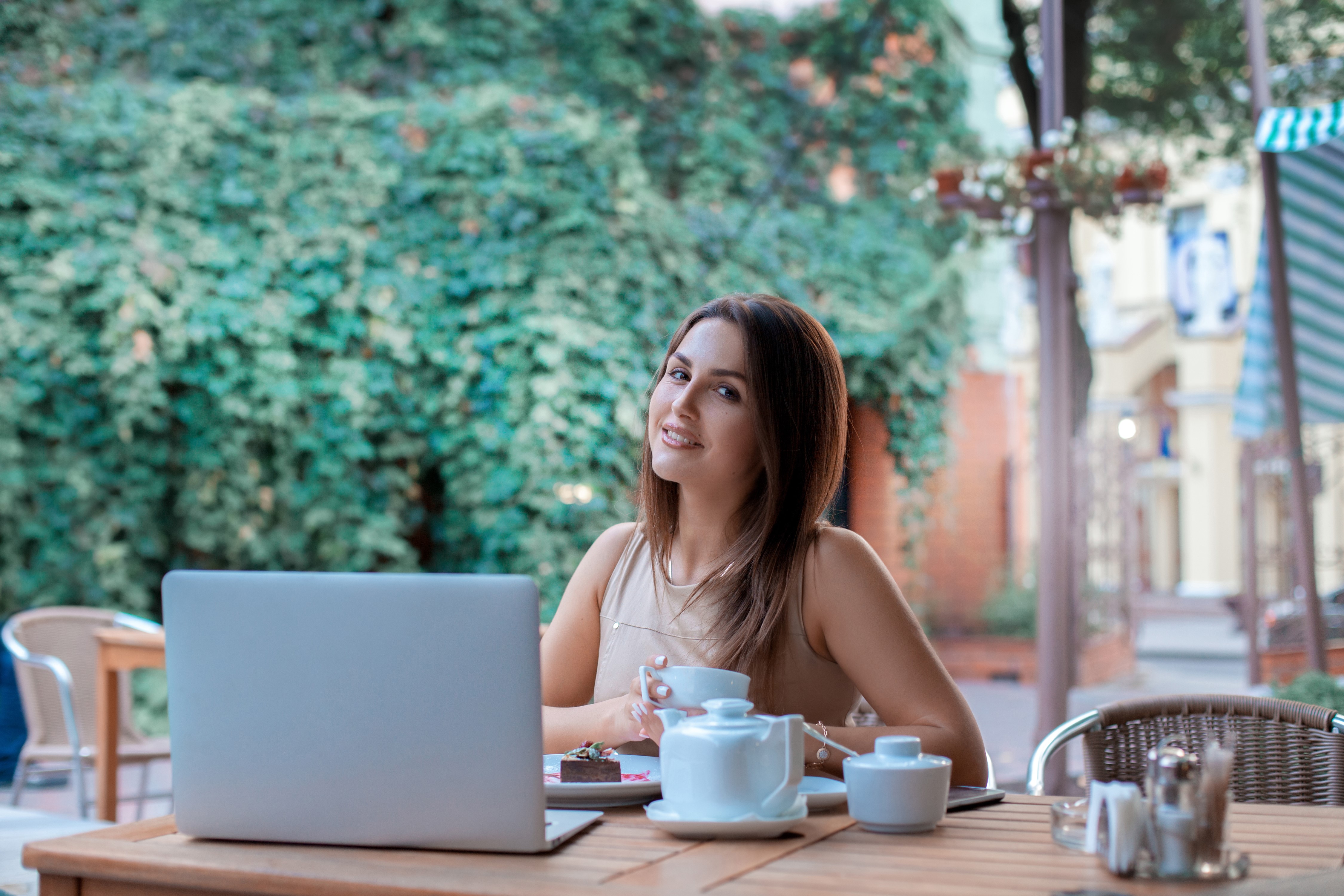 Woman with Laptop and Dessert at Cafe HD Wallpaper