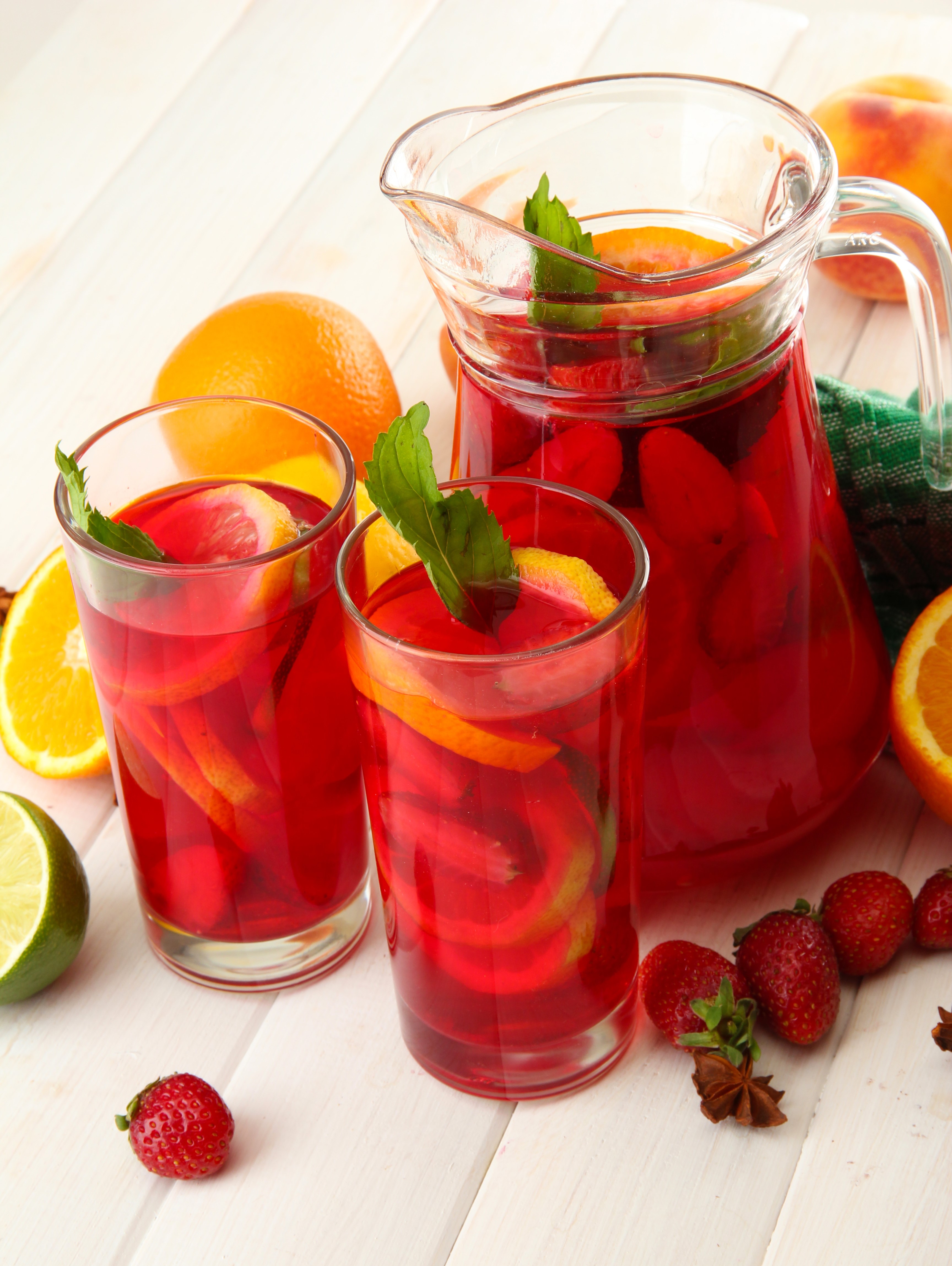 Pitcher and glasses of red sangria with fruits HD Phone Wallpaper