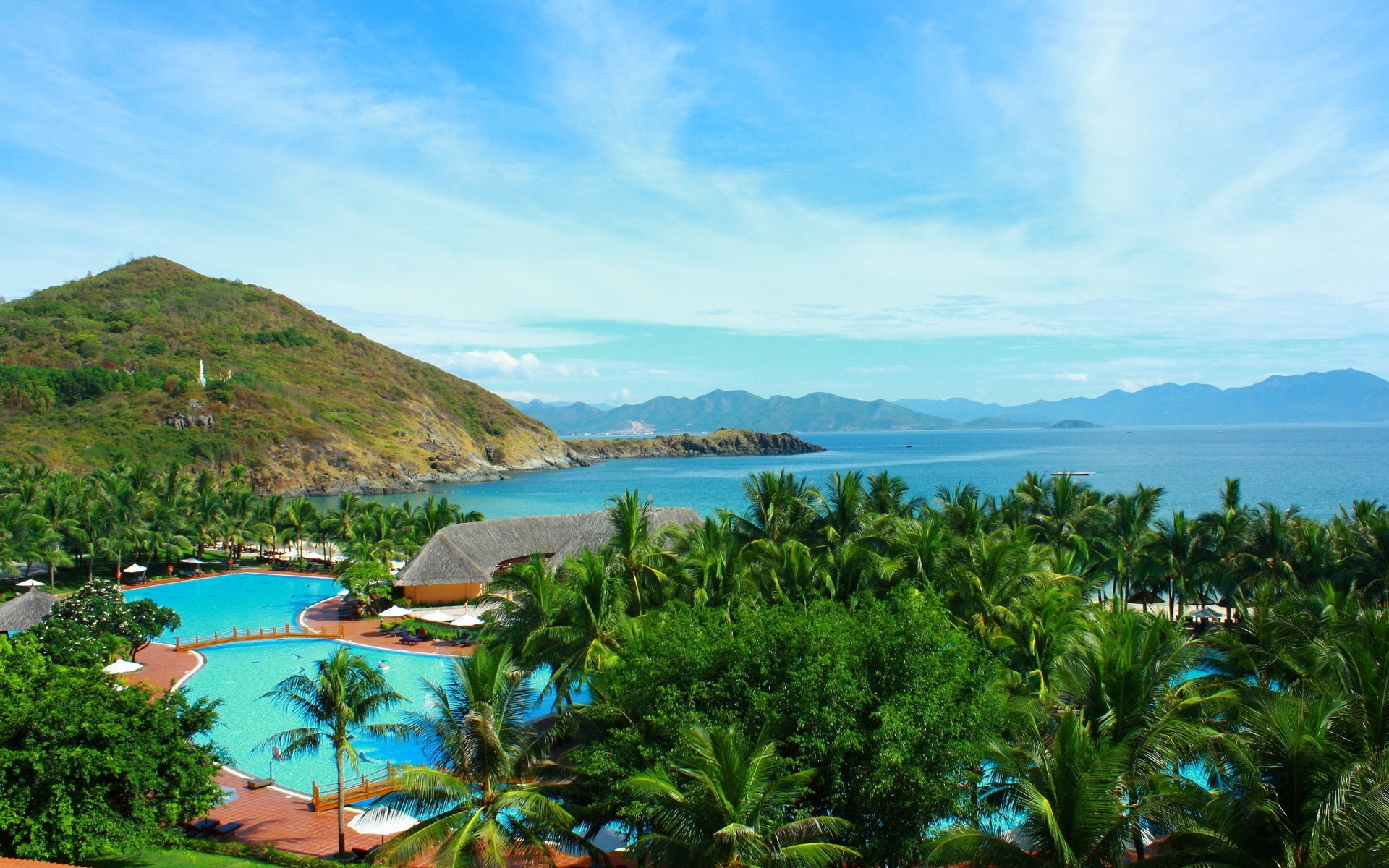 Tropical resort with swimming pools and ocean view HD Wallpaper