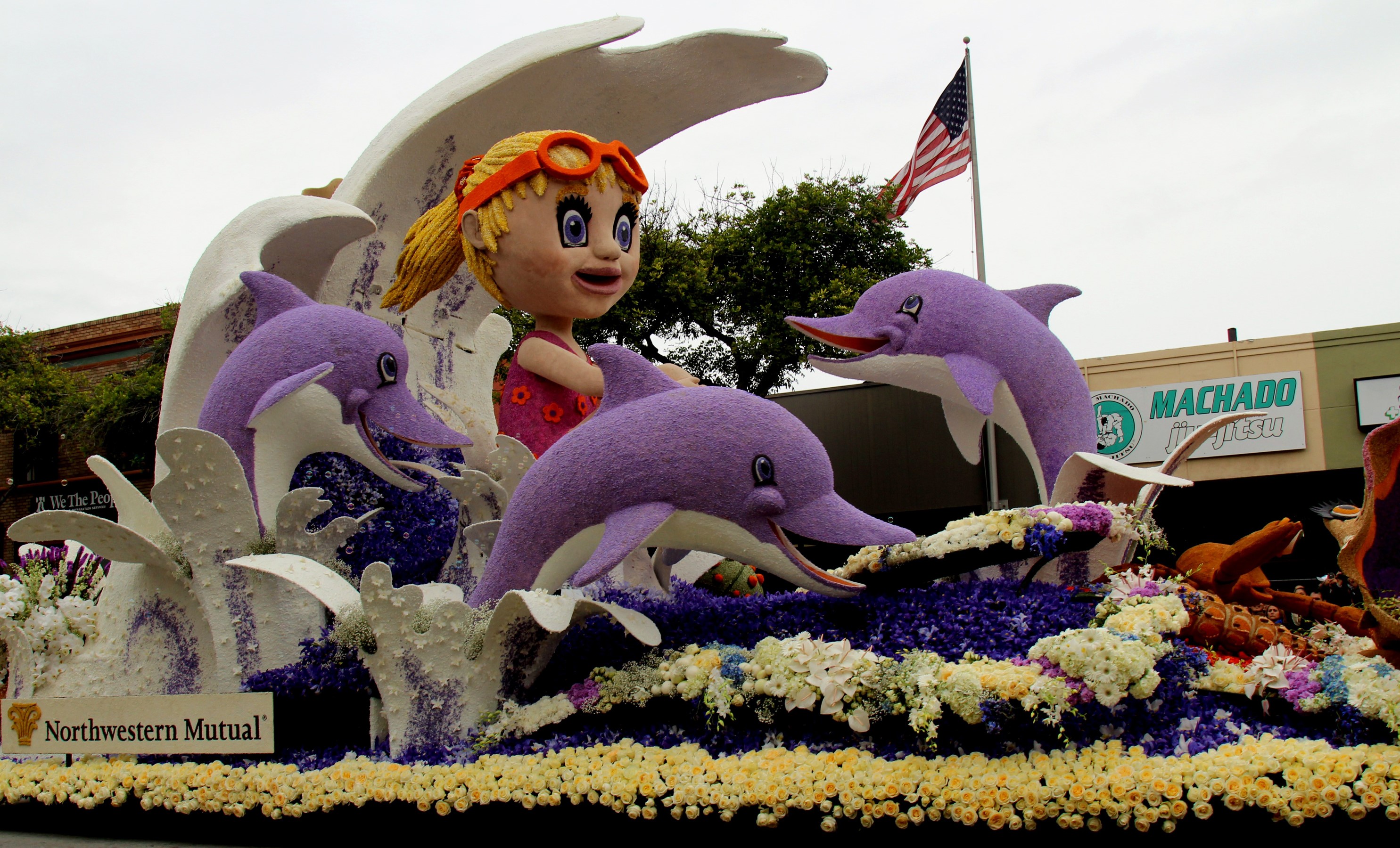 Northwestern Mutual float with girl and dolphins HD Wallpaper