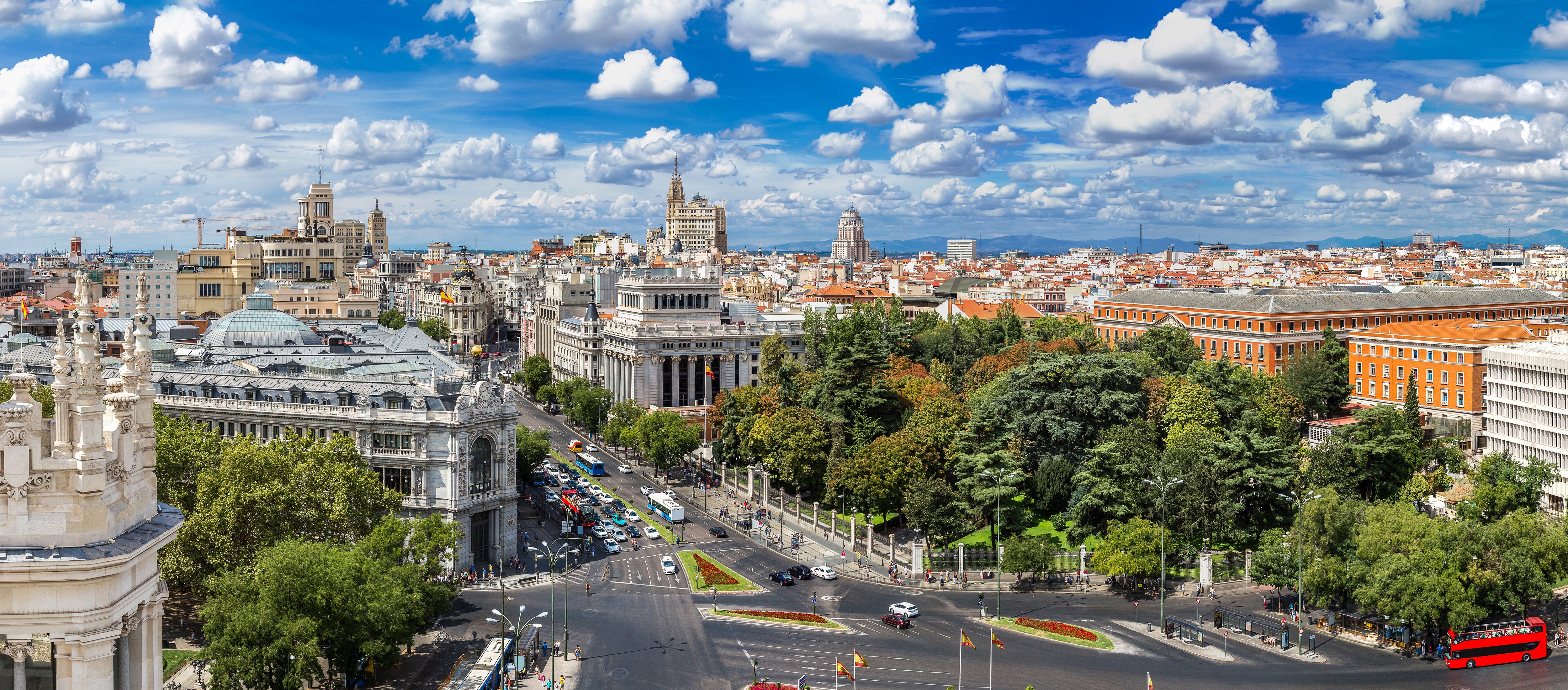 Madrid cityscape with buildings, trees, and roads HD Wallpaper