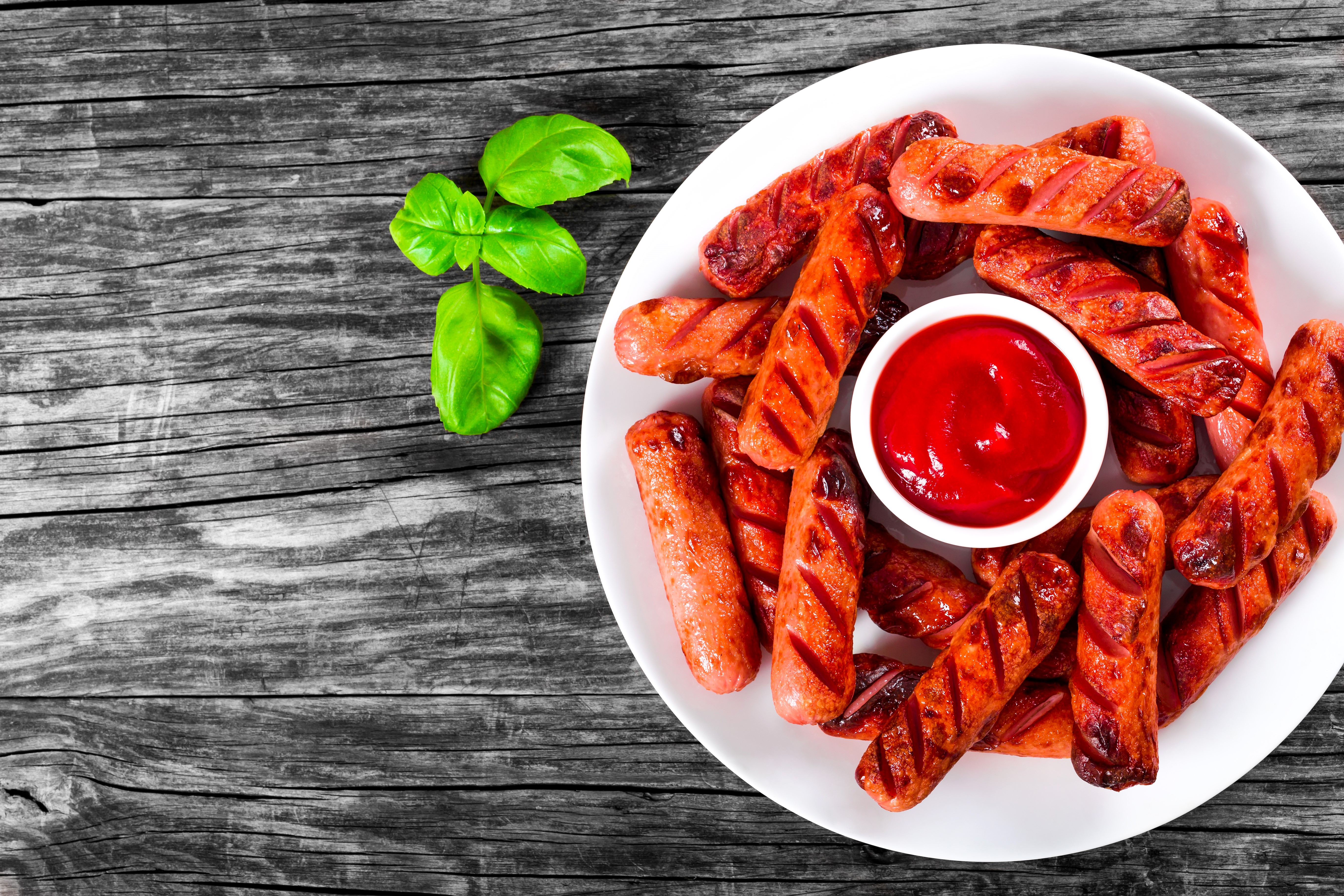 Grilled Vienna Sausages with Ketchup on a Plate HD Wallpaper