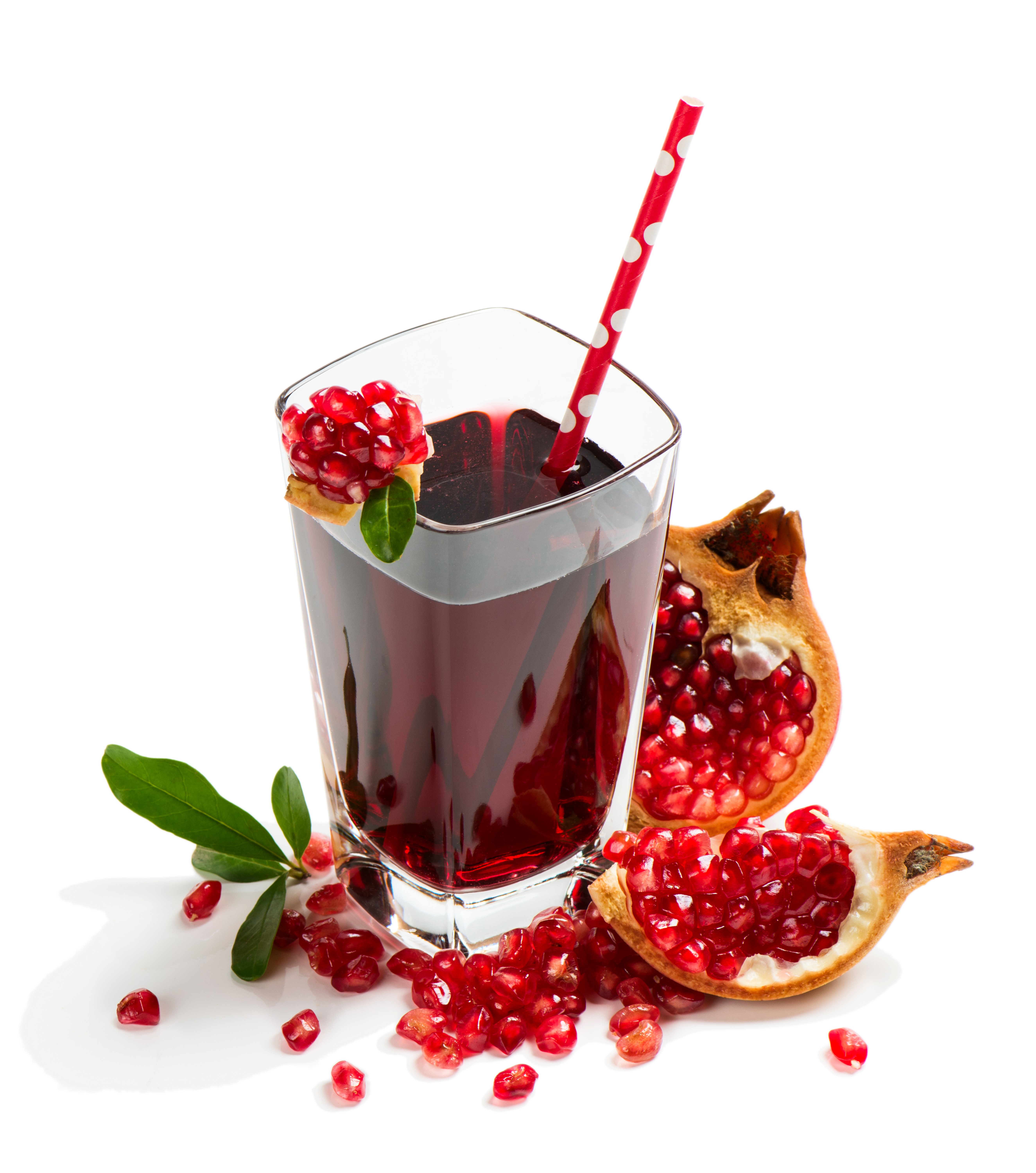 Pomegranate juice in a glass with pomegranates HD Wallpaper