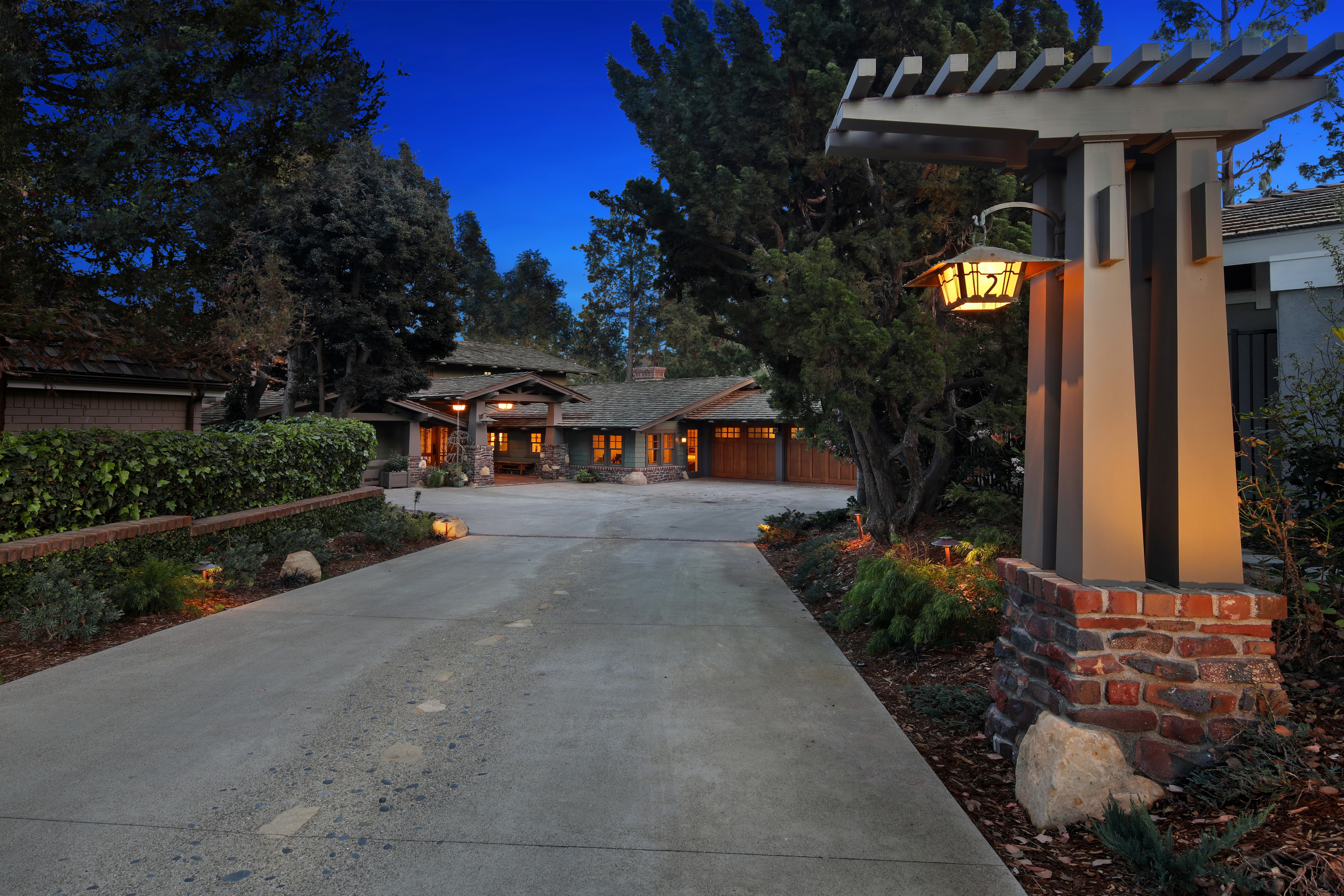 Luxury House with Driveway and Lamp Post at Dusk HD Wallpaper