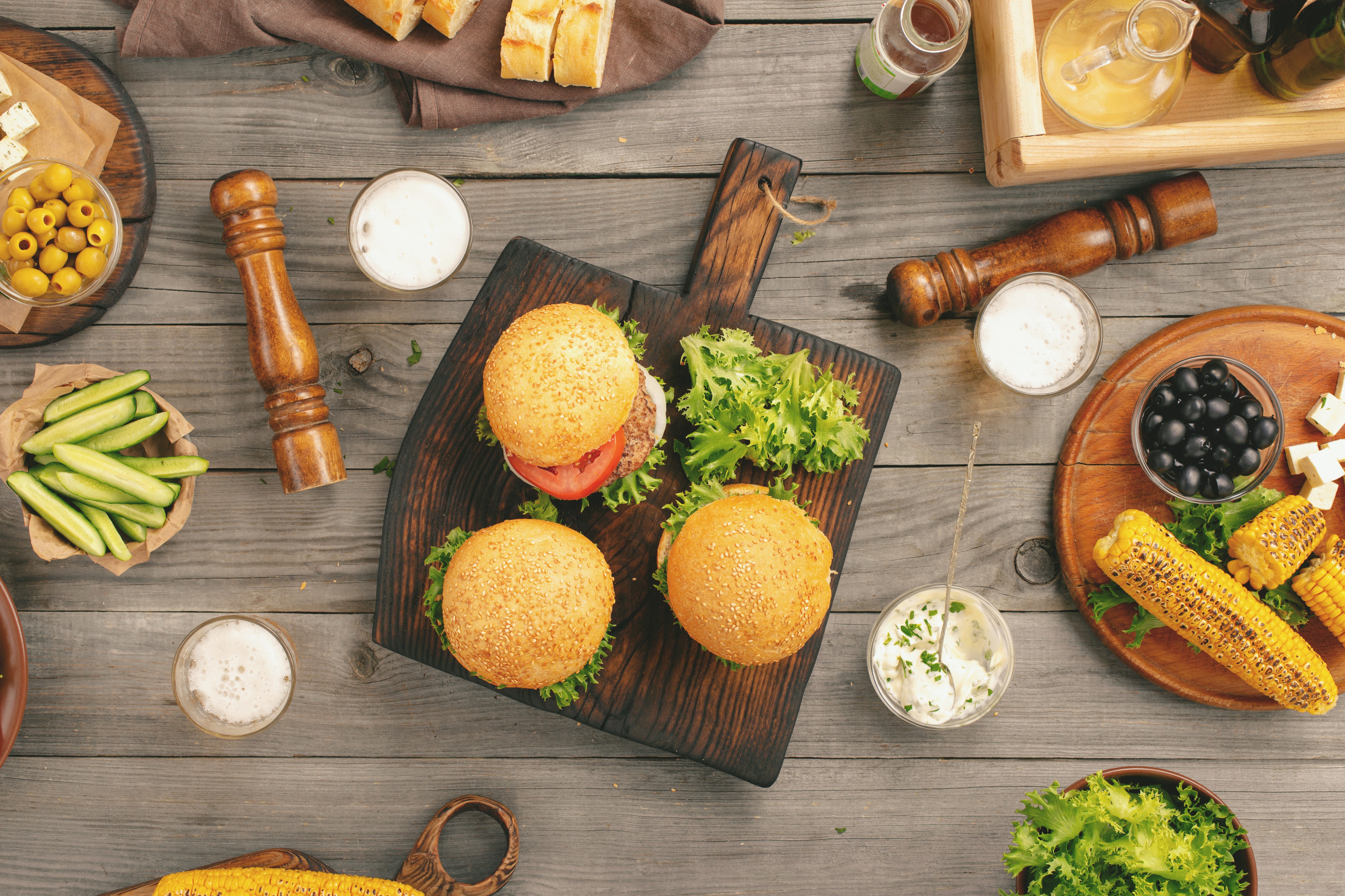 Sandwiches with Corn, Olives, and Bread on Wood HD Wallpaper