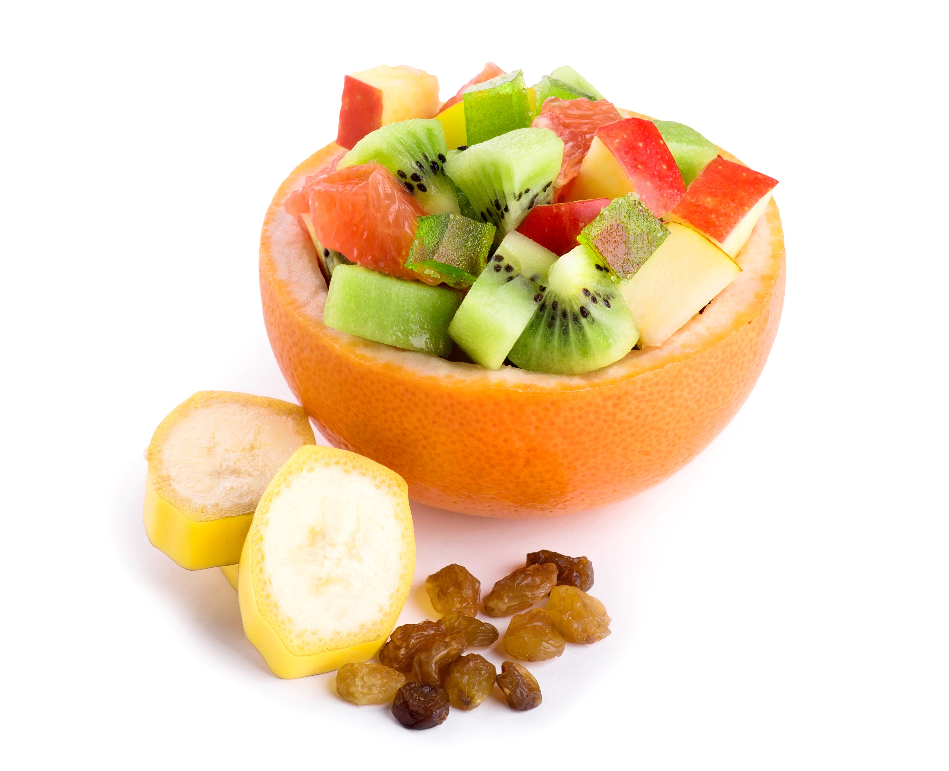 Fruit salad in grapefruit with banana slices and raisins HD Wallpaper